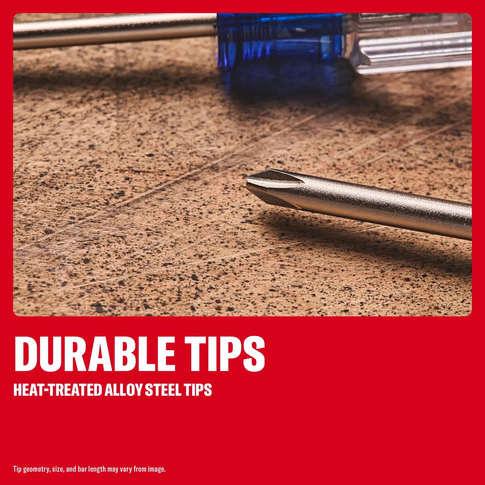 Close-up of a screwdriver with a durable, heat-treated alloy steel tip on a textured surface.