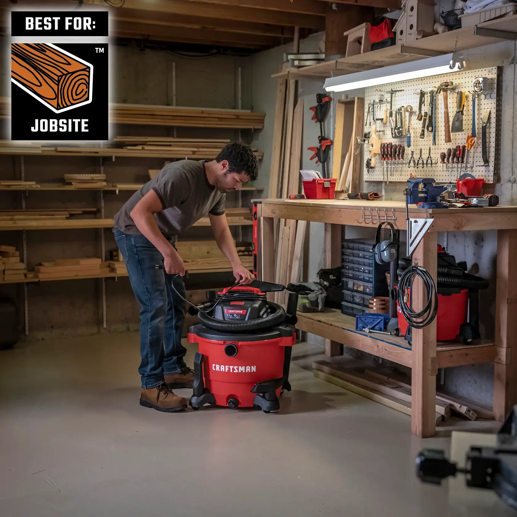 Man on jobsite getting ready to use a CRAFTSMAN Wet/Dry Vac with several attachments to chose from 