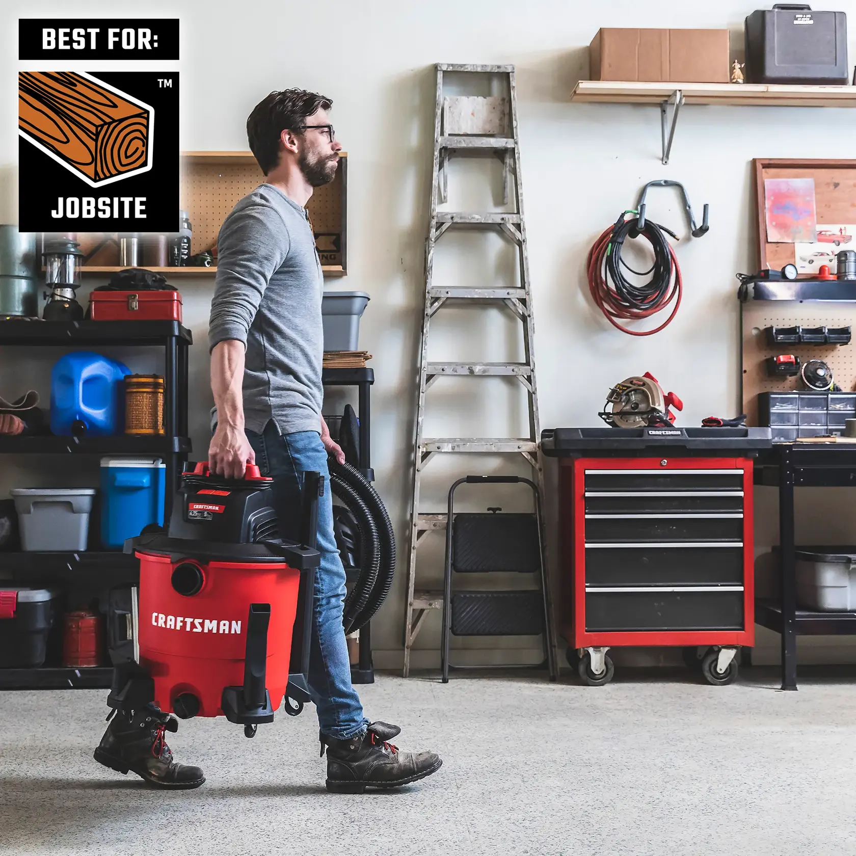 Man carrying the CRAFTSMAN Wet/Dry Vac to a jobsite by convenient handle 