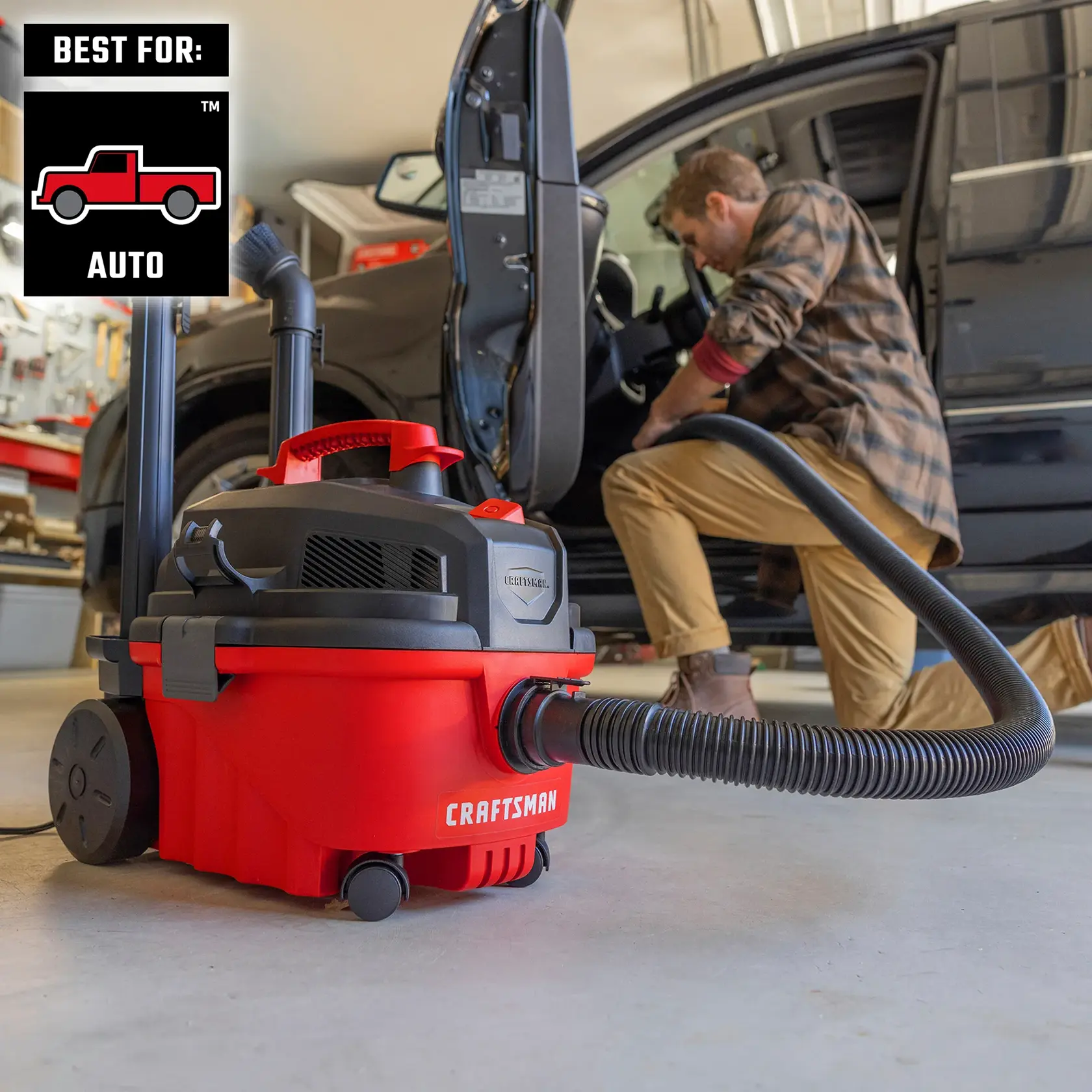 Man cleaning inside a car with CRAFTSMAN Wet/Dry Vac, additional accessories stored on unit
