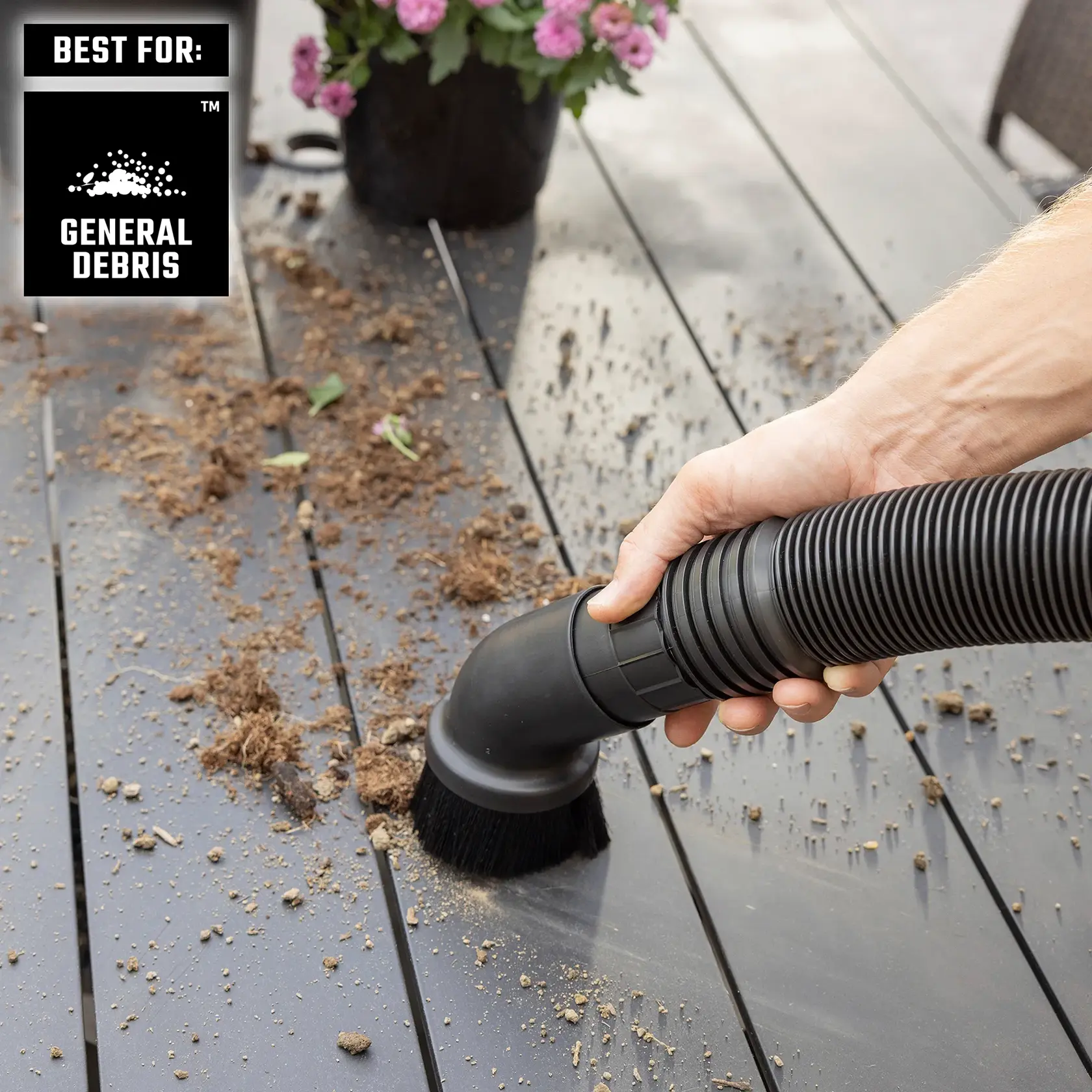 Homeowner using CRAFTSMAN Vac with Standard Filter, Dusting Brush to pickup soil and dirt on deck