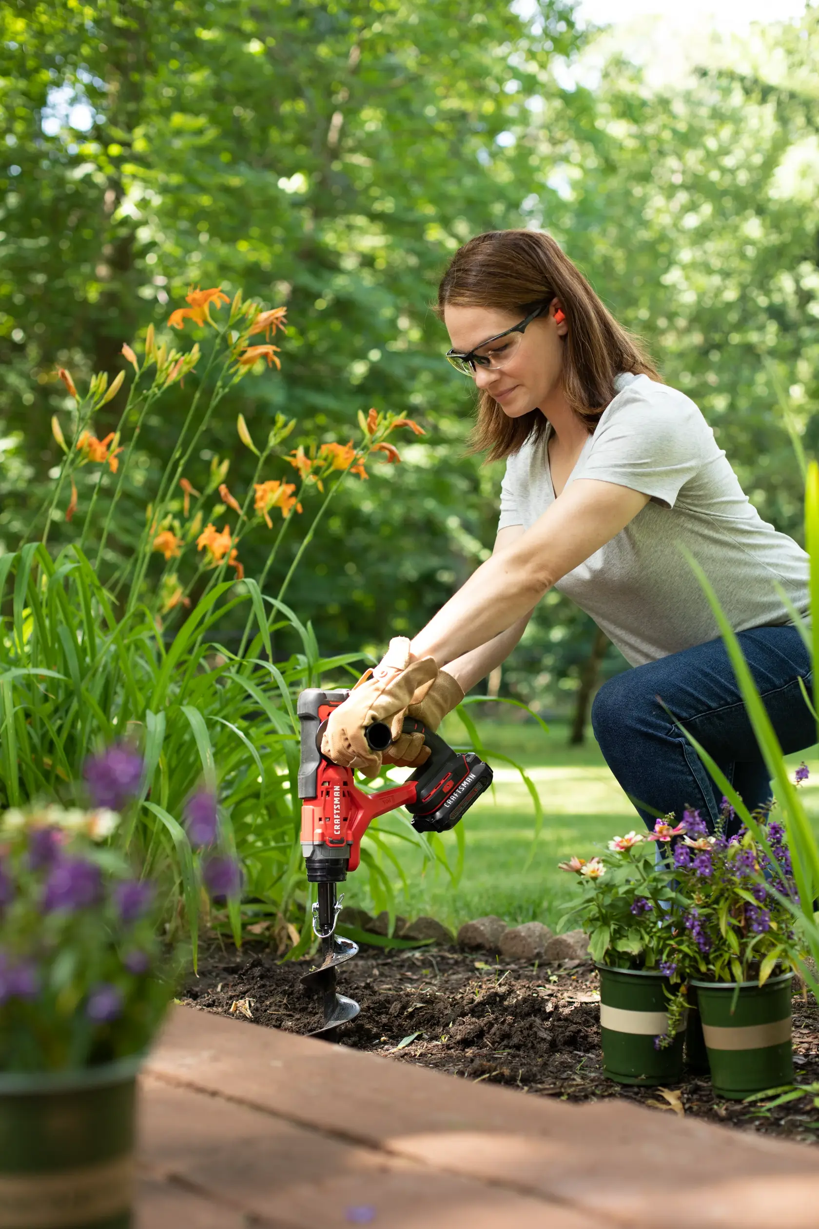 CRAFTSMAN V20* Multi-Use Garden Tool drilling hole in flowerbed for flower placement