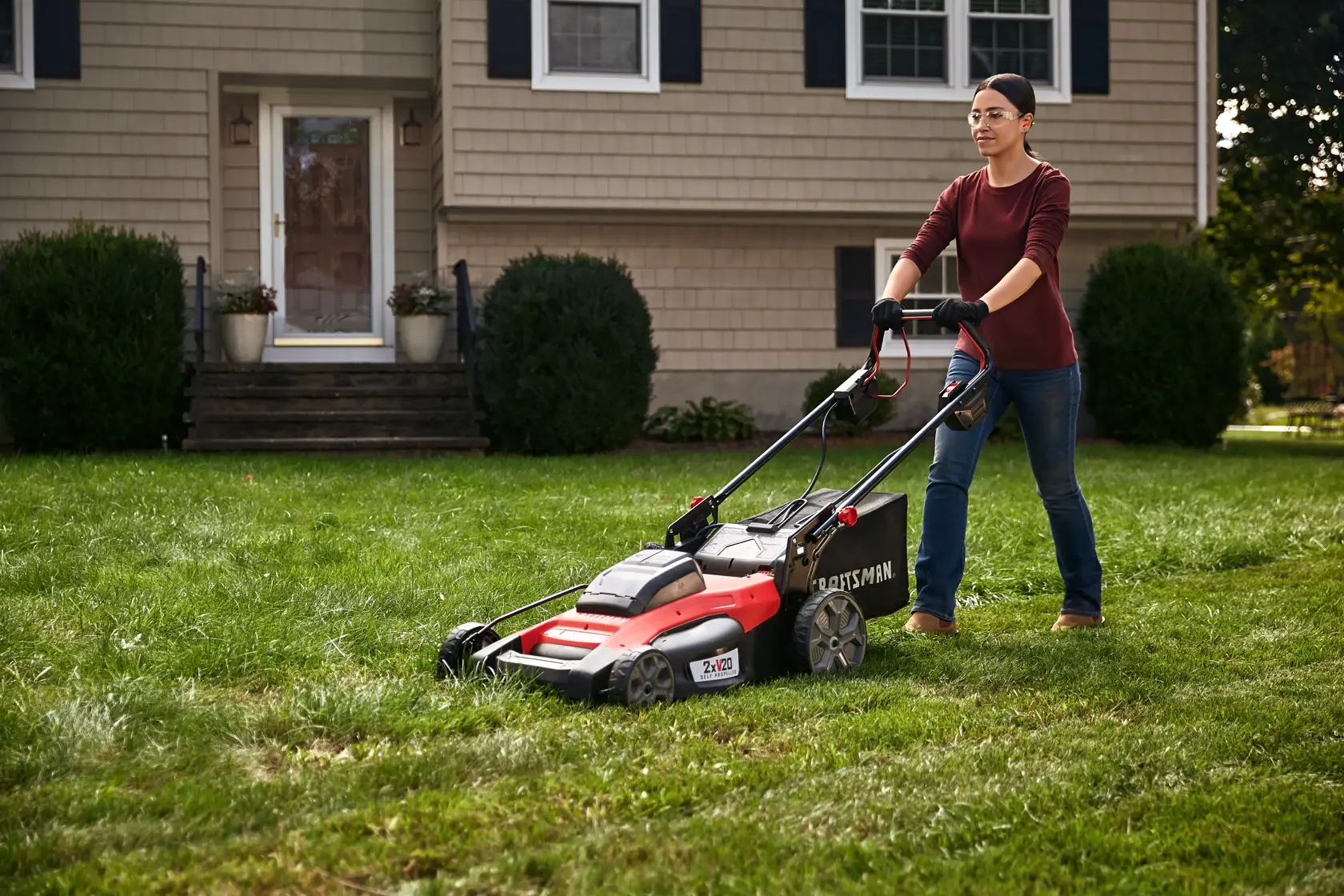20 inch brushless cordless self propelled mower kit being used for mowing grass.