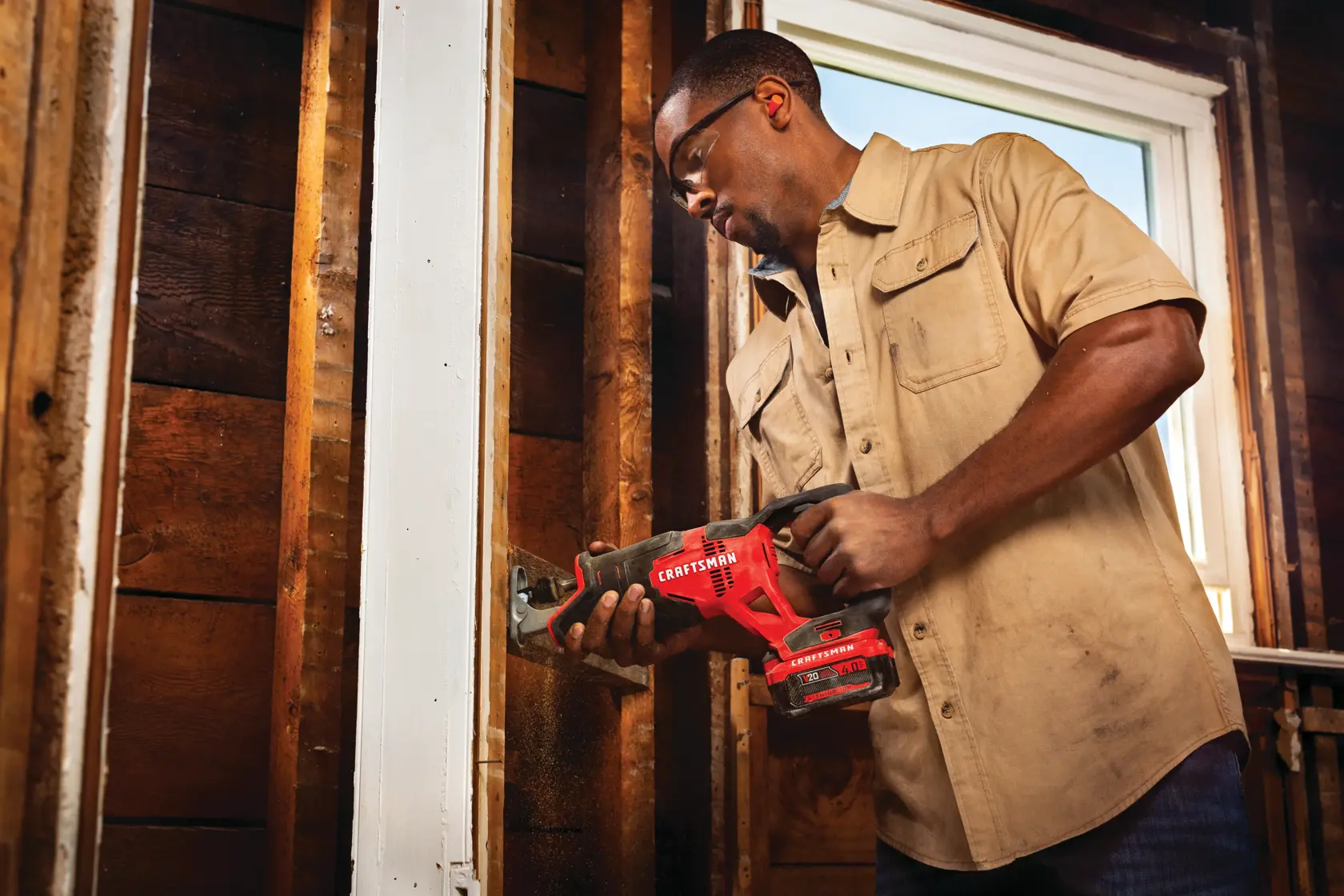 20 volt cordless reciprocating saw kit being used by a person indoors.