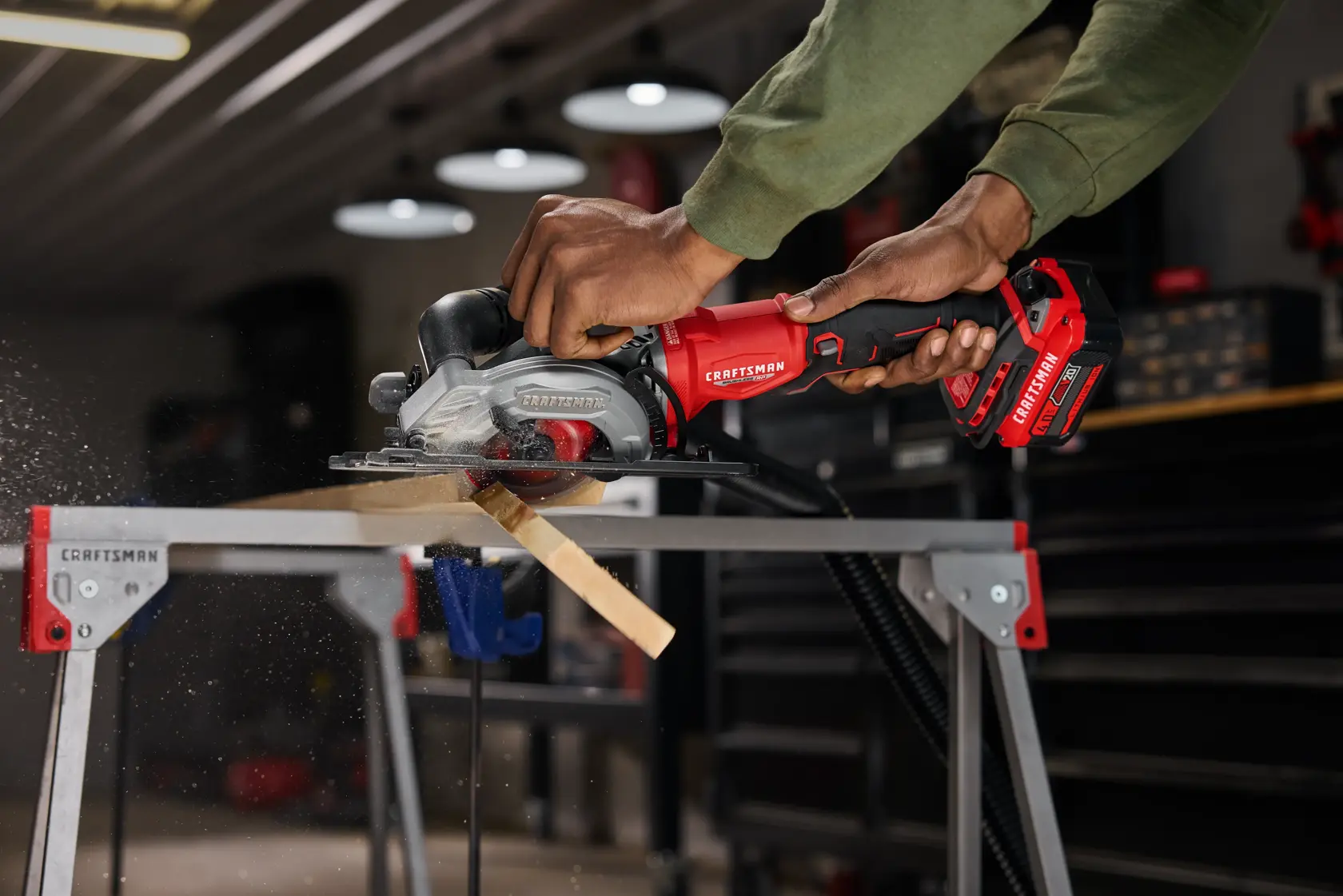 CRAFTSMAN V20* RP 4.5” Circular Saw cutting through 2x4 showing vacuum
 attachment