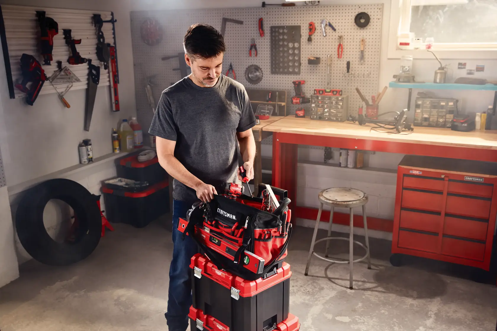 Versastack 17 inch tool bag being used by a person.