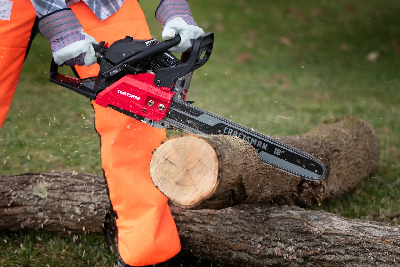 CRAFTSMAN S185 Gas Chainsaw cutting tree branches in yard in side view