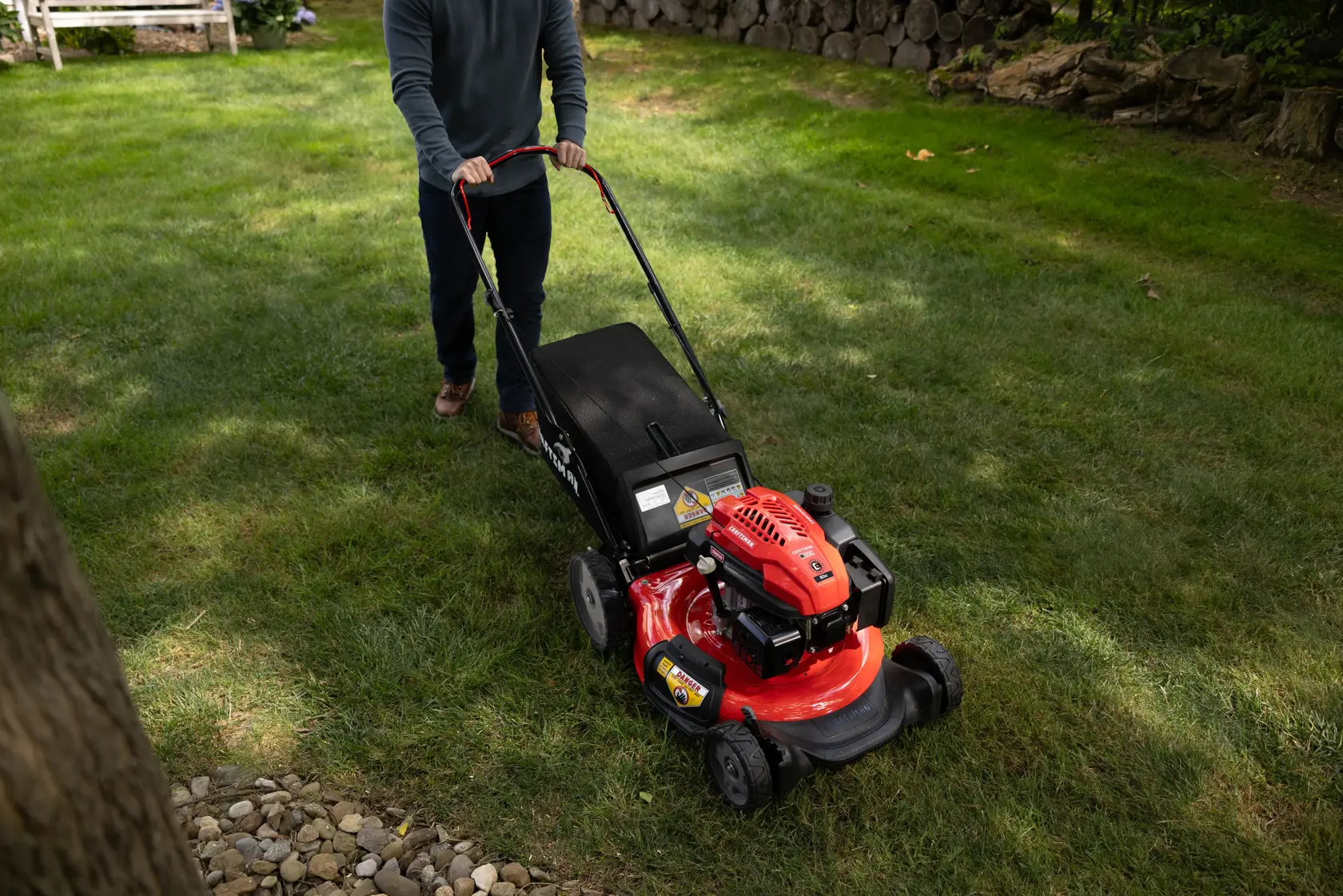 Man using CRAFTSMAN 163cc 21-in. Gas Push Mower (M125C)