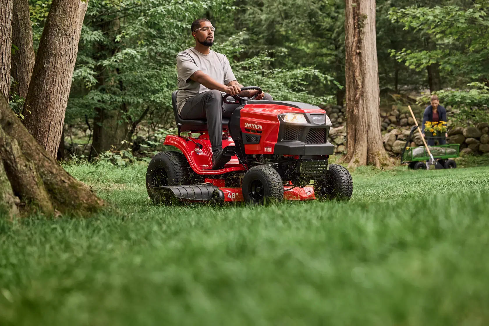 Wide shot cutting grass with the CRAFTSMAN� T150 46-Inch 19 HP Single-Cylinder Gas Riding Lawn Mower