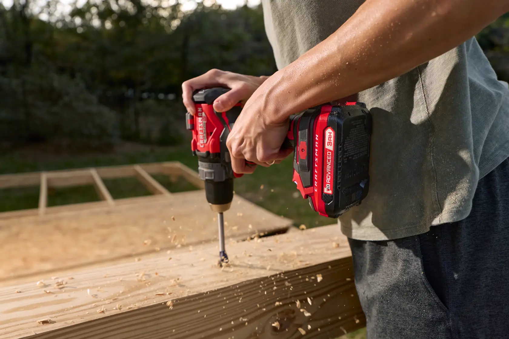 Man using Craftsman 20V drill to drill screws into wood