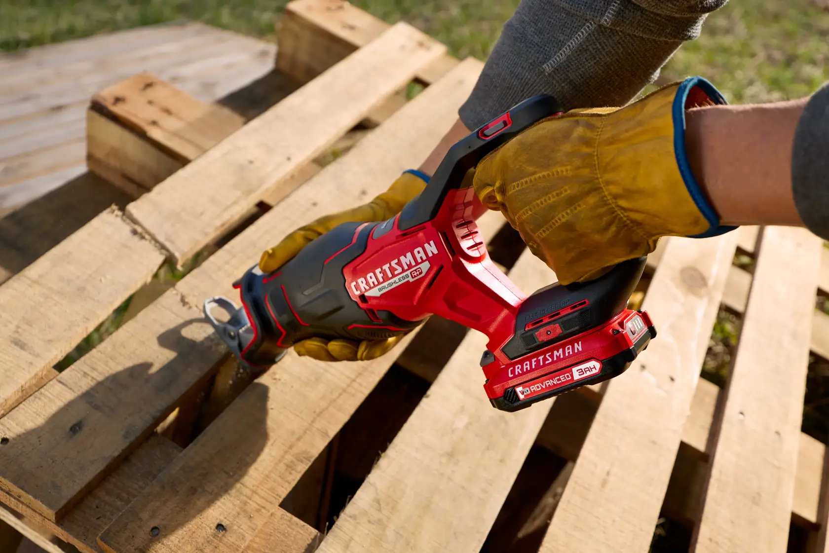 Man uses Craftsman 20V brushless saw to cut through a pile of wood