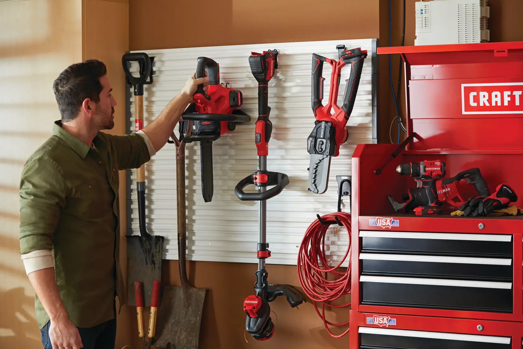 12 inch cordless compact chainsaw kit 4 amp hour is being hung on organization shelf.