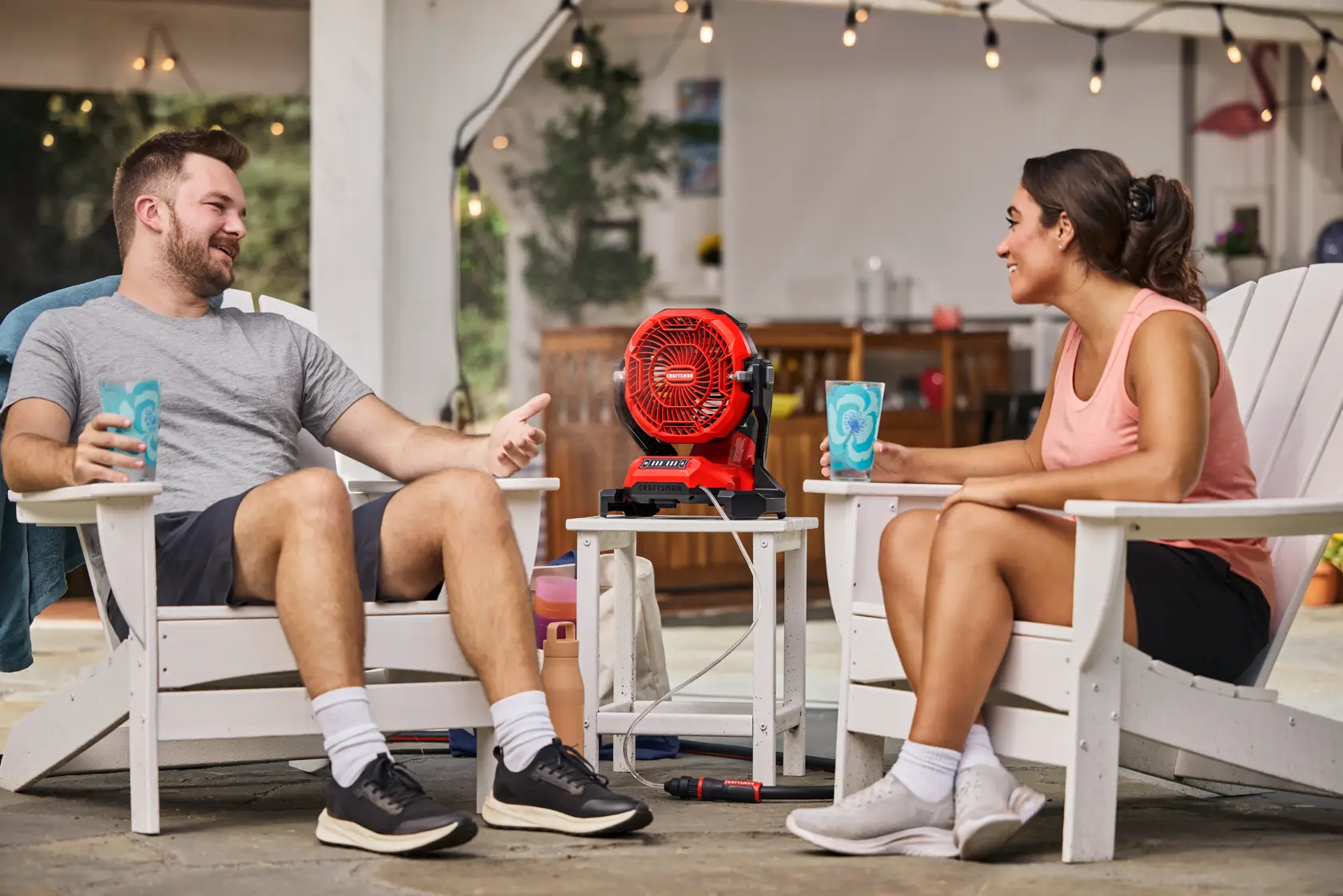 Couple enjoying the CRAFTSMAN� V20* Cordless Misting Fan with CMXMHBB16513 Hose attached