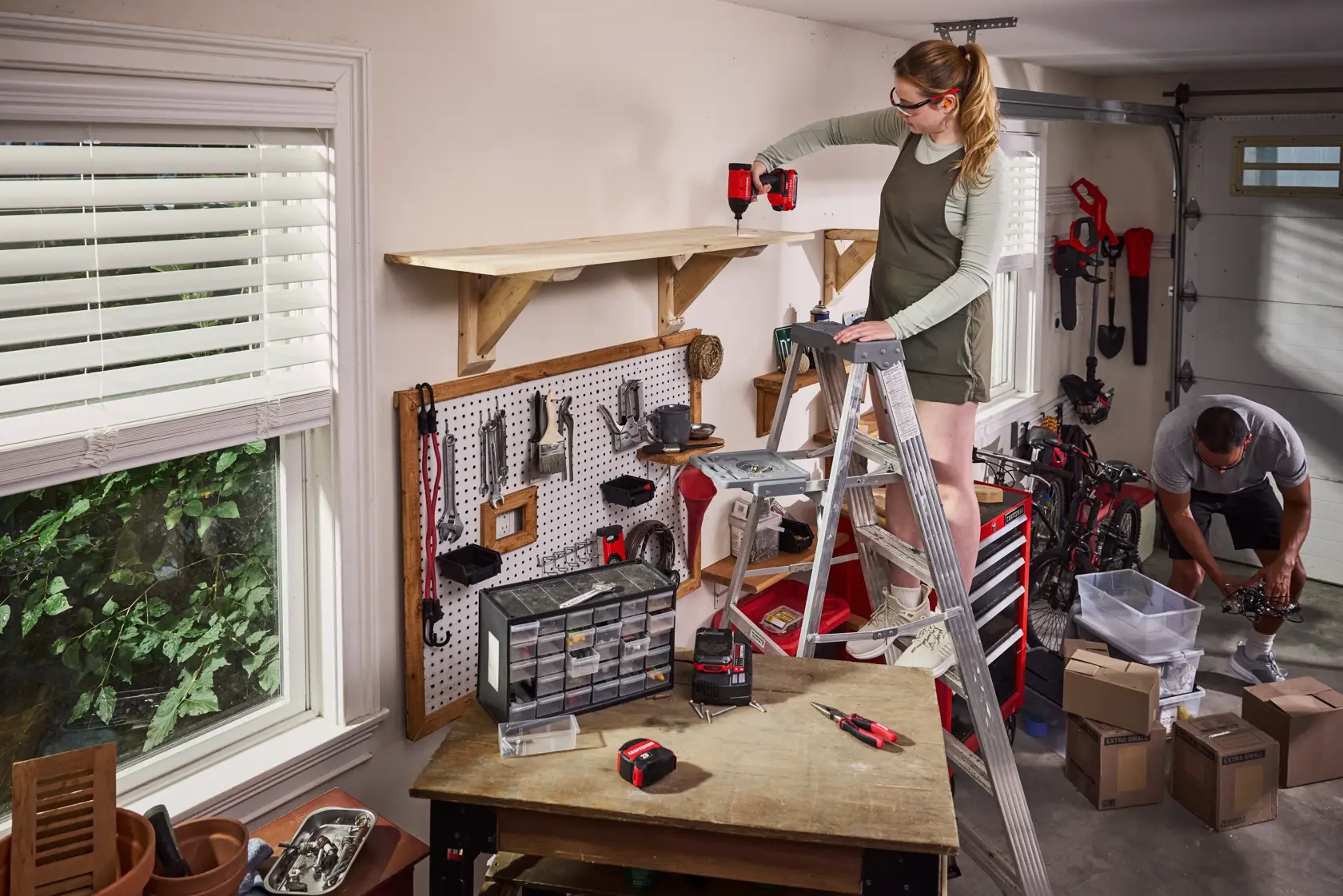 Couple hanging garage shelves with the CRAFTSMAN� V20* Brushed Impact Driver