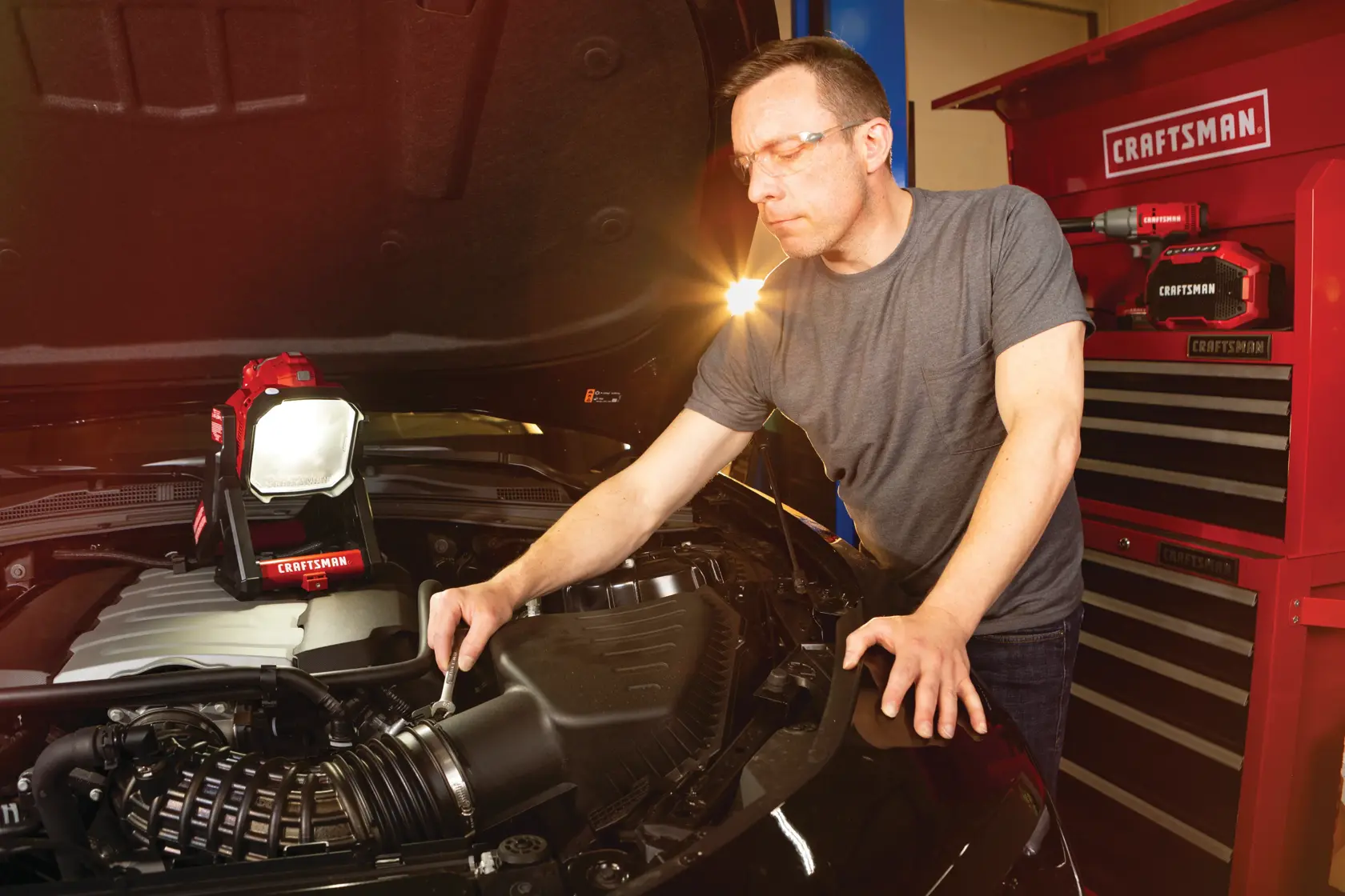 Cordless small area light tool only being used for fixing car engine.