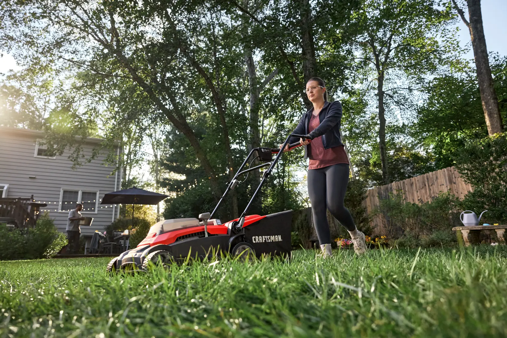 Couple completing yard work on a smaller lot size with the CRAFTSMAN� 2xV20* 15 IN. PUSH MOWER KIT
