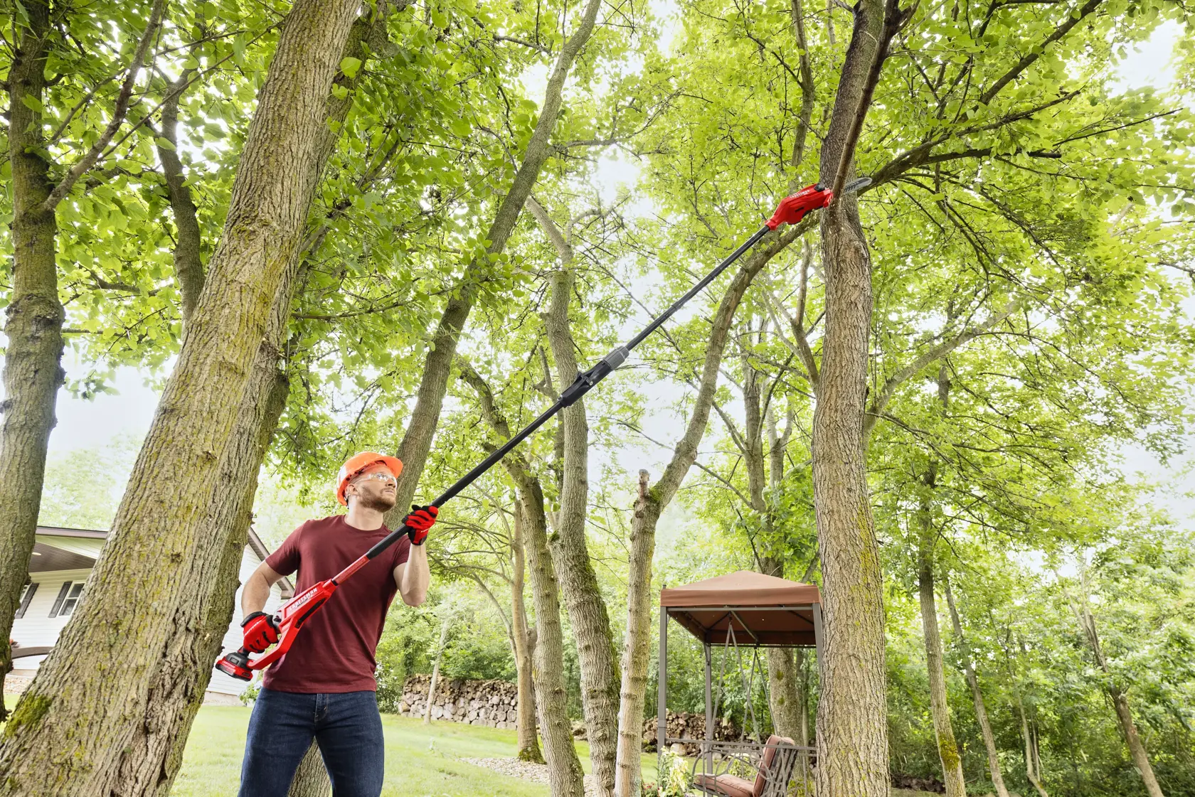 Man cutting branch with CRAFTSMAN V20 BRUSHLESS RP Pole Saw 