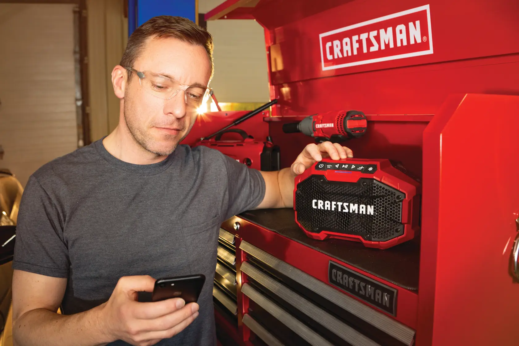 Photo of Craftsman CMCR001B Bluetooth speaker on red tool chest with Craftsman branding visible.