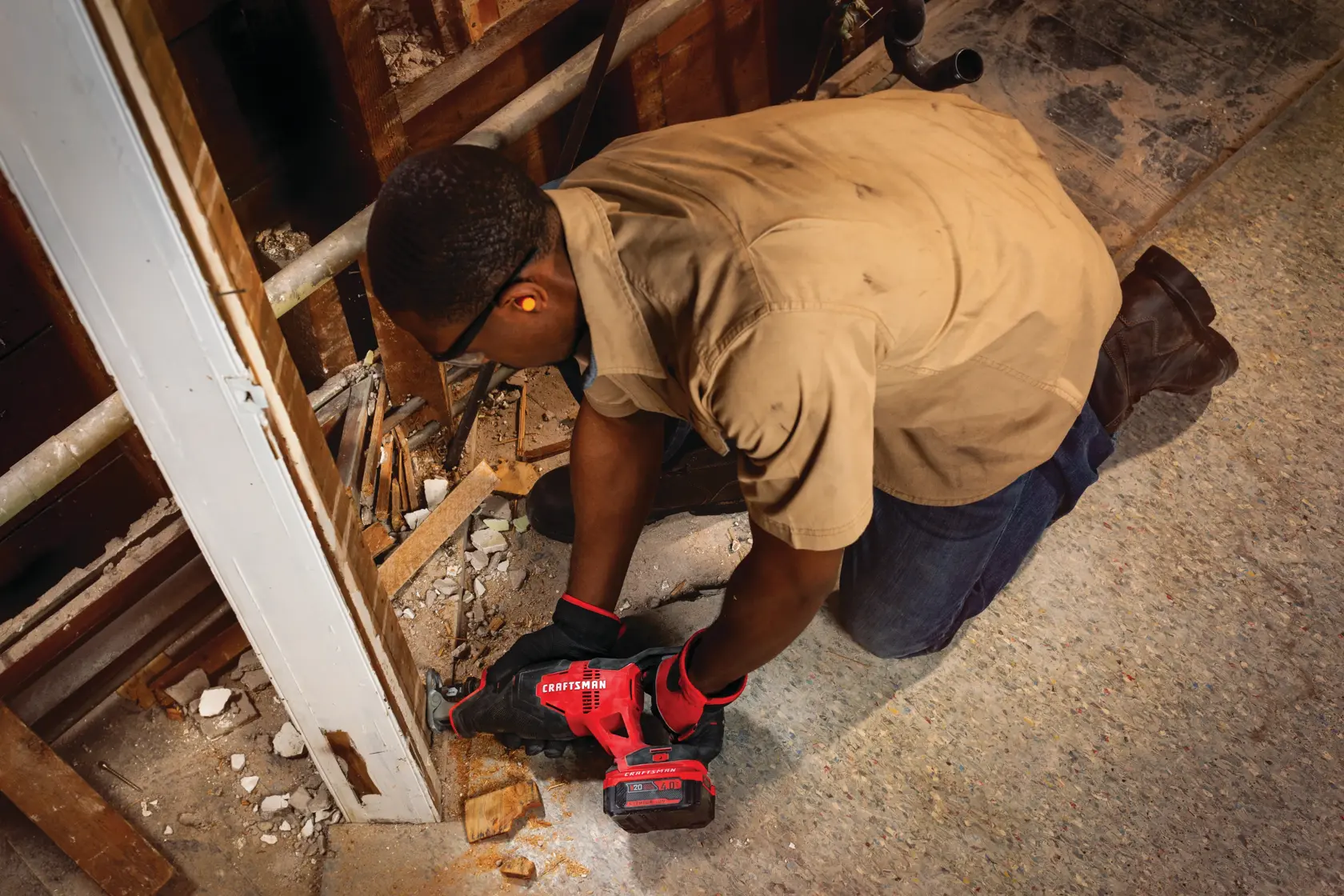 20 volt cordless reciprocating saw kit being used by a person.