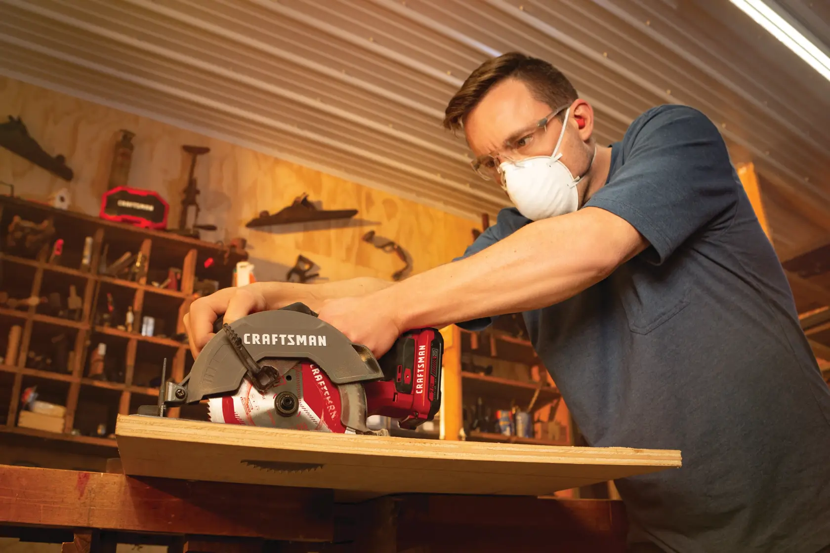 21 volt cordless 6 1 half inch circular saw kit being used by a person to cut wooden plank.