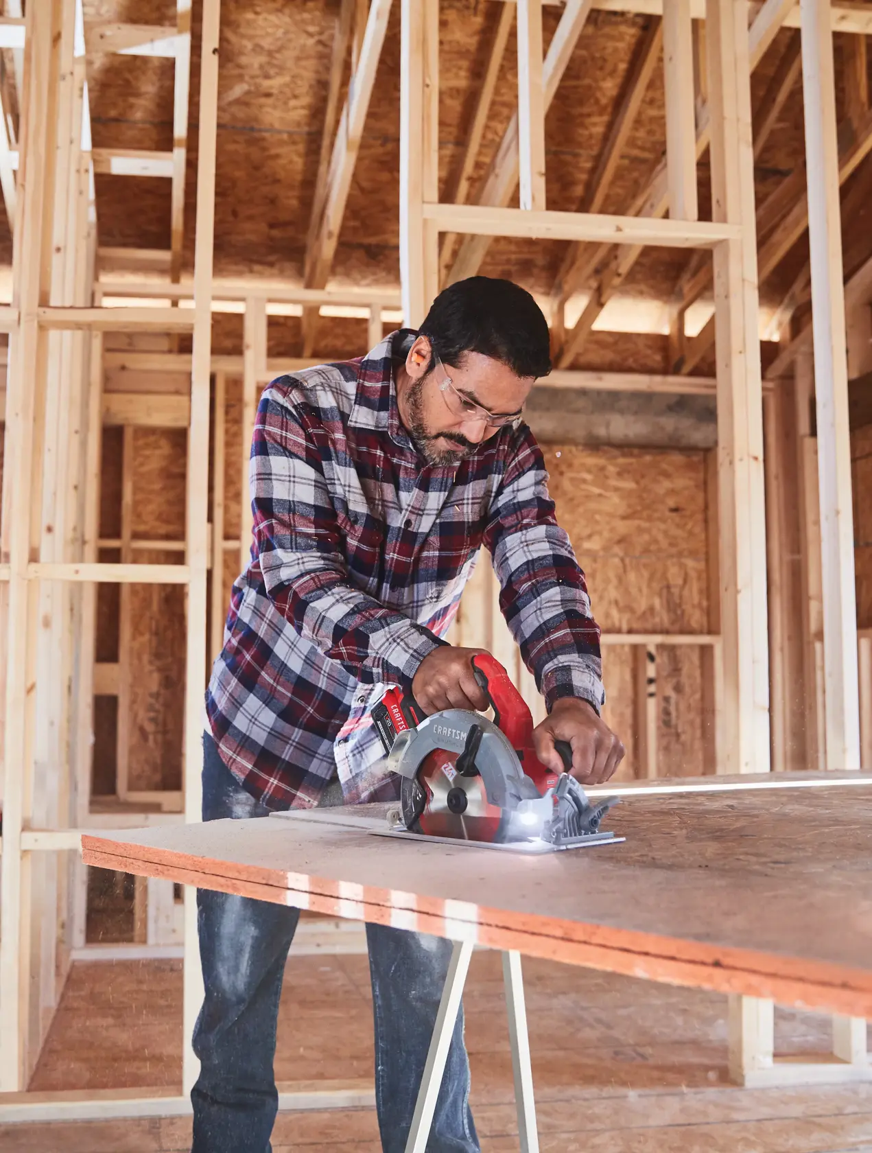 20 volt 7 1 quarter inch brushless cordless circular saw being used by a person to cut wood.