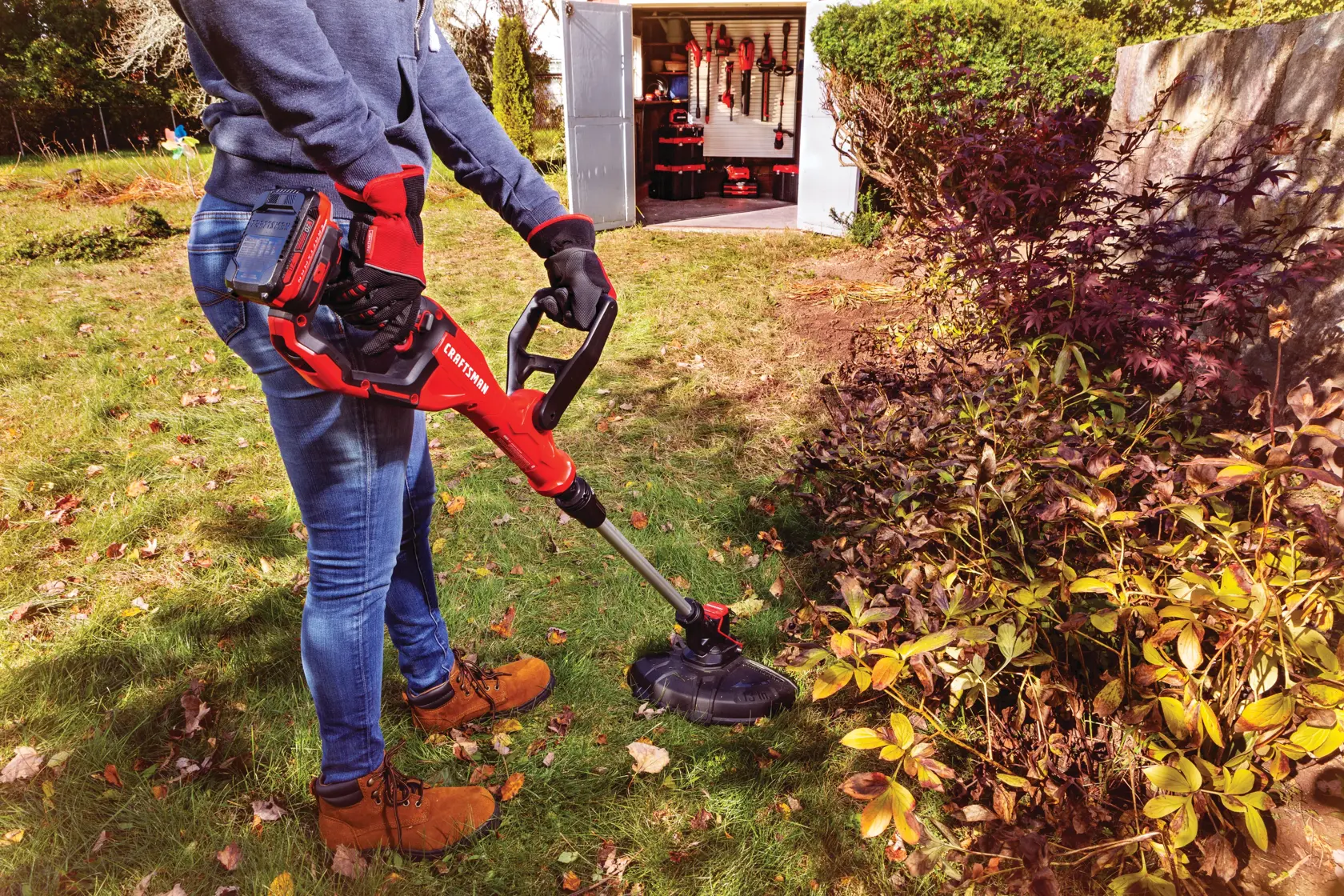 20 volt weedwacker 13 inch cordless string trimmer and edger with automatic feed kit being used by a person.