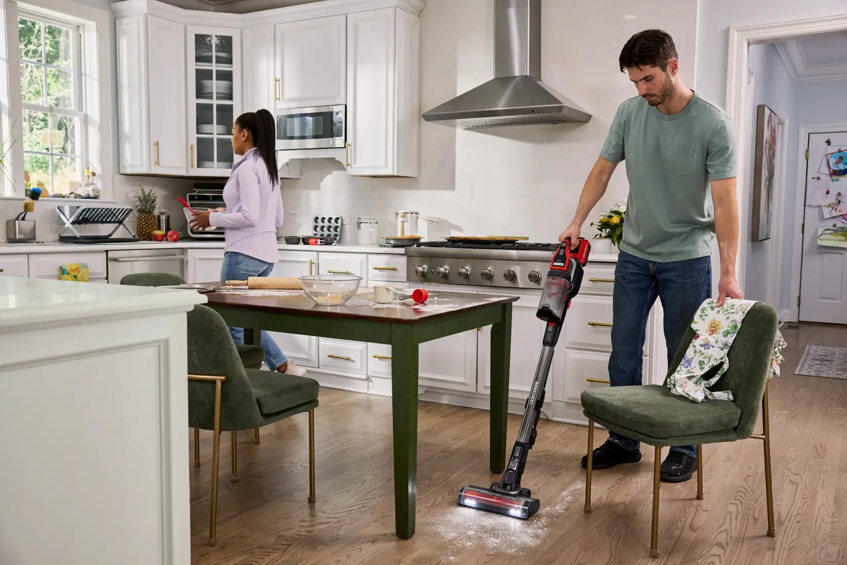 Wide angle kitchen setting cleaning flour spill with CRAFTSMAN V20* BRUSHLESS RP™ Cordless Stick Vacuum