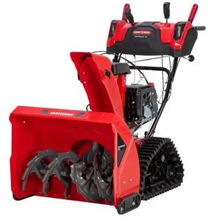 A red Craftsman snow blower with tracks and large metal auger blades, designed for clearing snow from driveways and walkways.