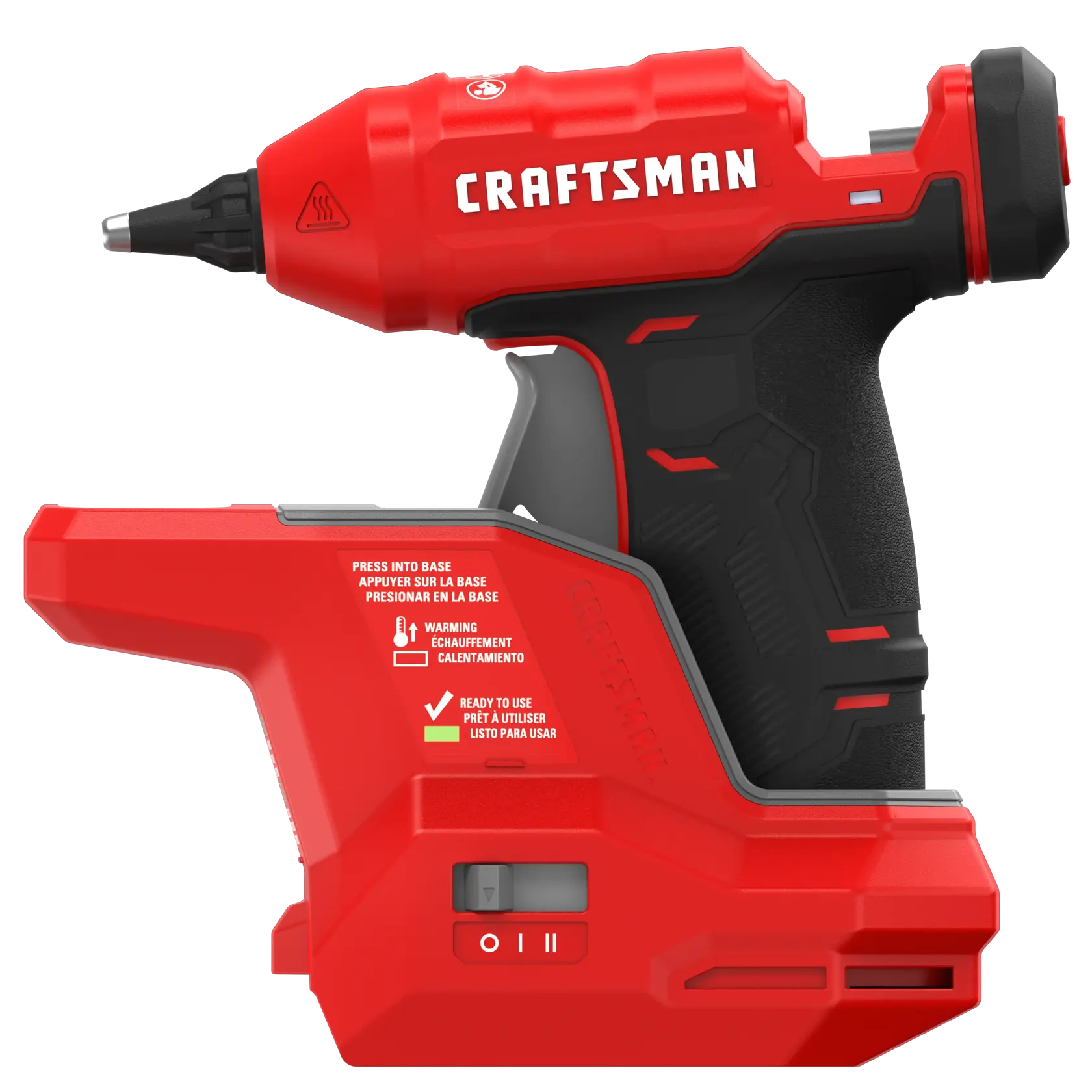 A red and black cordless hot glue gun branded CRAFTSMAN, displayed on its charging base. The base has instructions and warnings printed in English, French, and Spanish. The device features a trigger and a switch on the base for power settings.