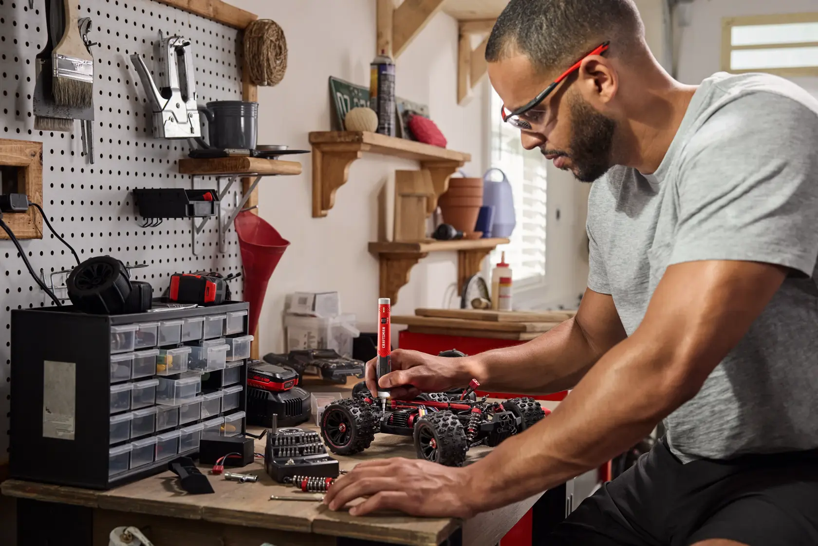 Man fixing child's car toy with the CRAFTSMAN® 4V Precision Screwdriver