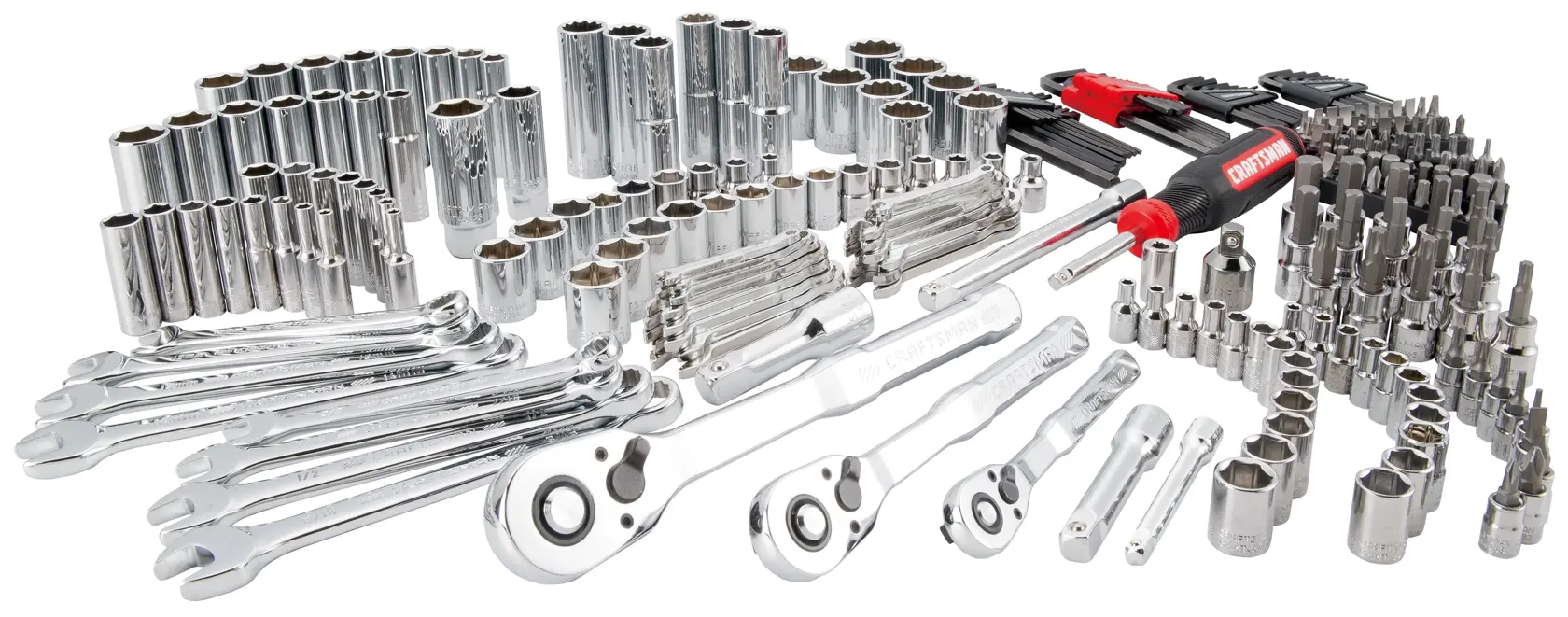A large set of mechanic's hand tools including ratchets, wrenches, sockets, screwdrivers, and assorted bits, all made of shiny metal and arranged neatly for display.