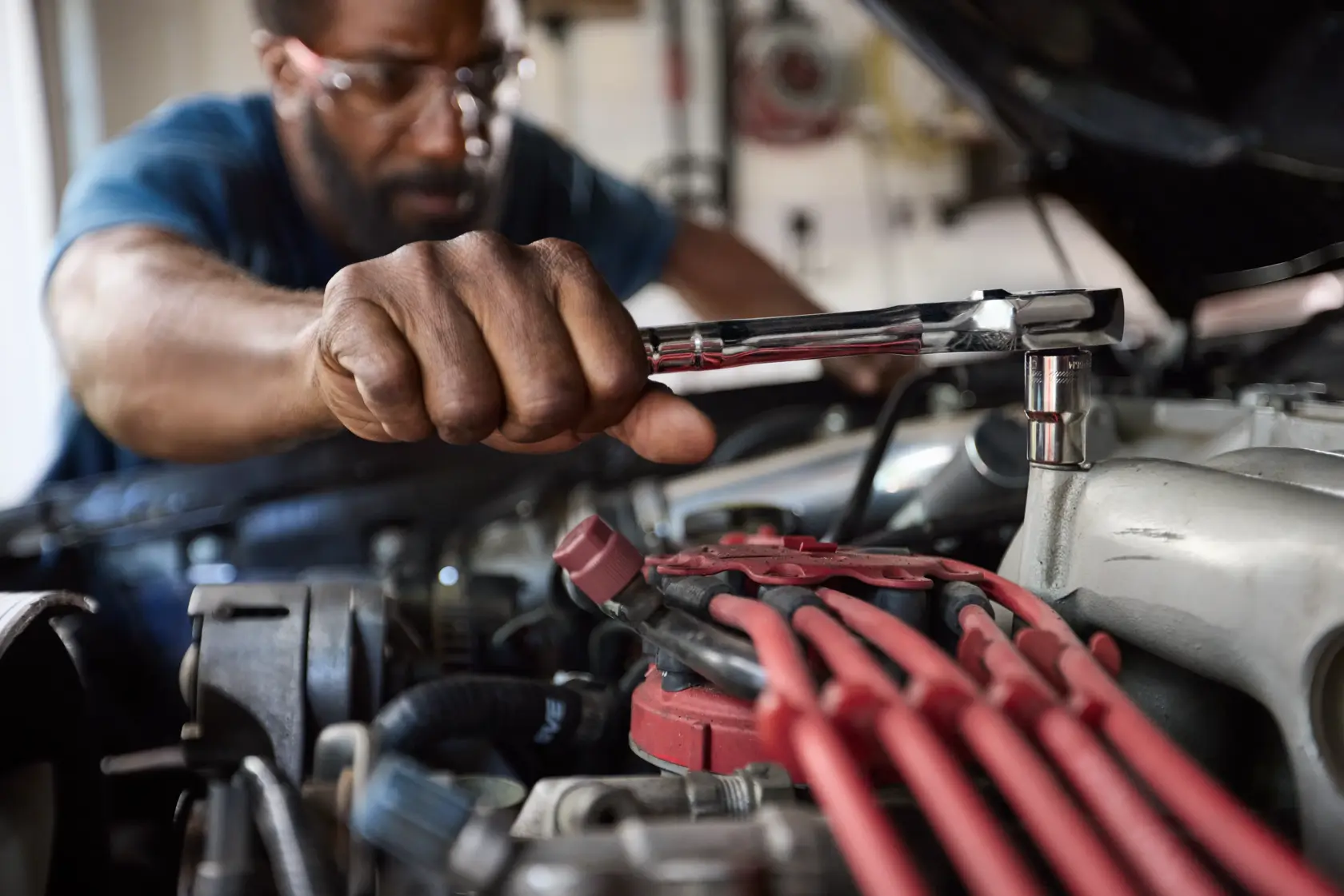 Father working under car hood close up of CRAFTSMAN® 154PC OVERDRIVE ™ Mechanics Tool Set