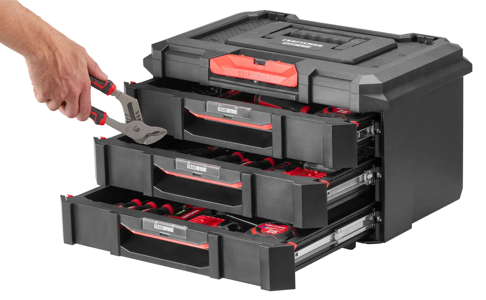 Man putting tools in CRAFTSMAN TRADESTACK Portable Storage Unit