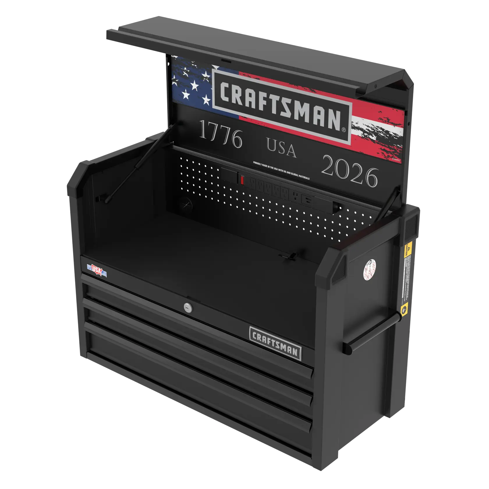 A black Craftsman tool chest with its top compartment open, showing the American flag design and the numbers 1776 and 2026 on the back panel. The unit features a pegboard section, multiple power outlets, and three lower drawers.