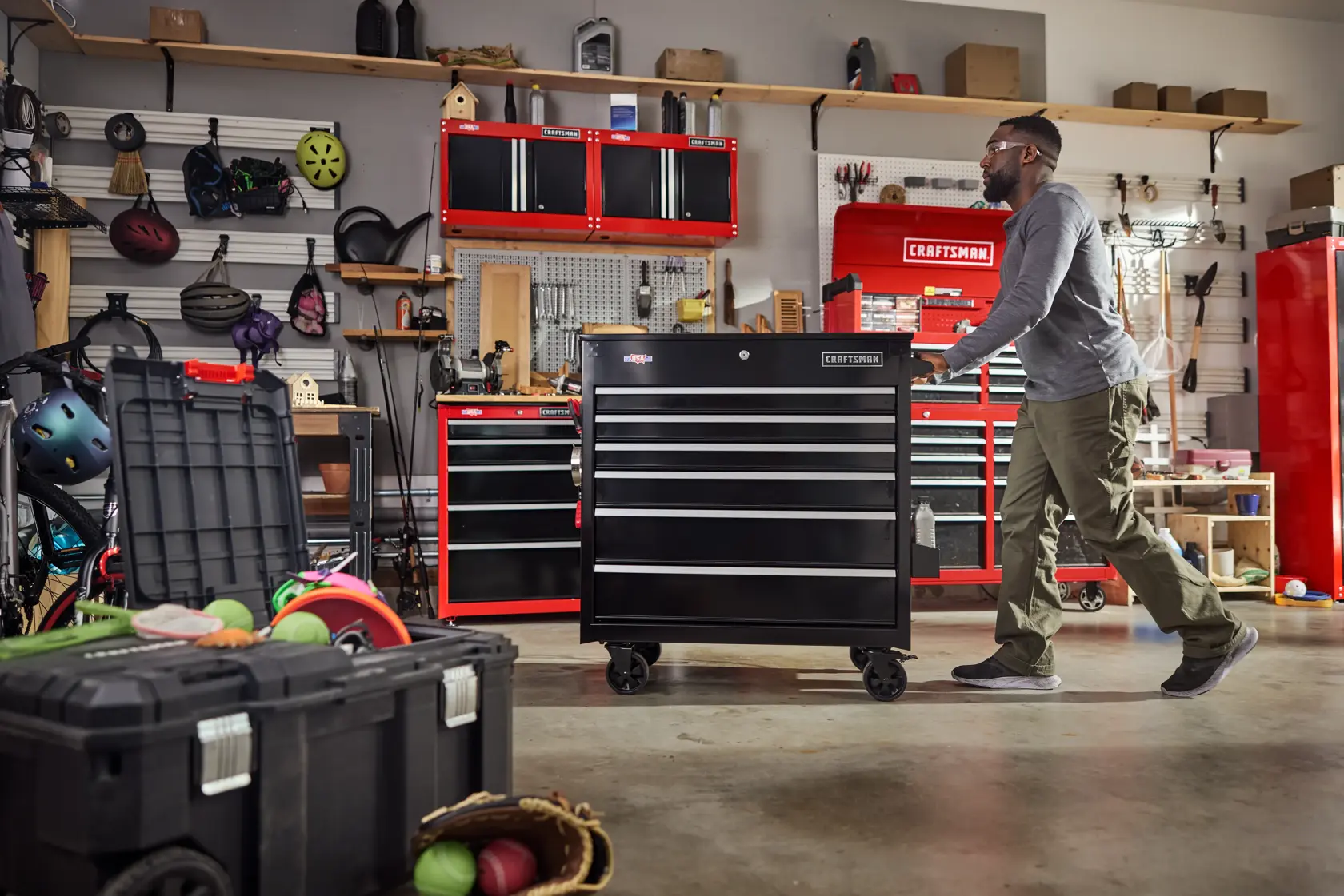 Photo of Craftsman rolling tool chest, SKU CMSTUC06BK, black with multiple drawers in a garage setting.