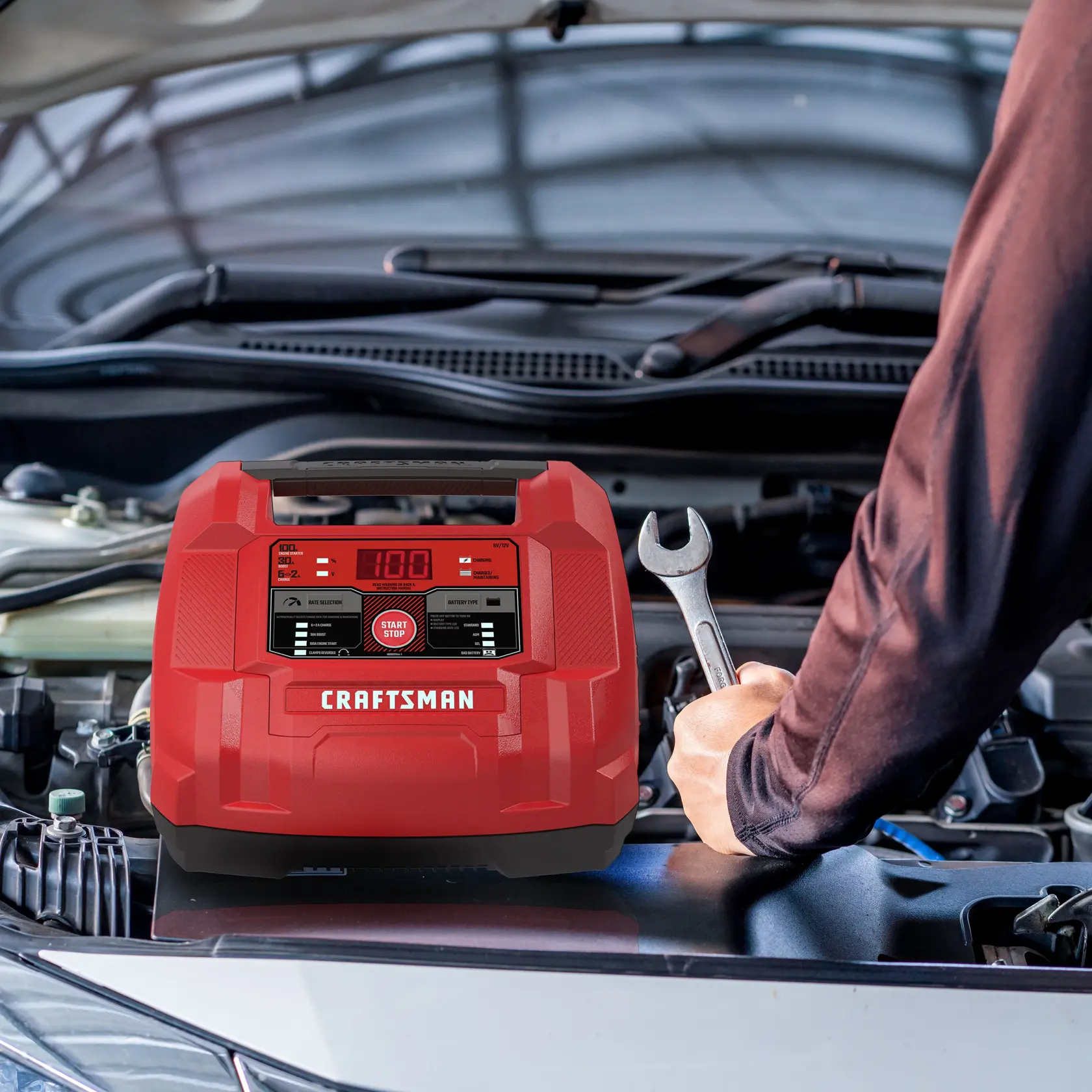 100A 6V/12V Fully Automatic Battery Charger and Jump Starter in use