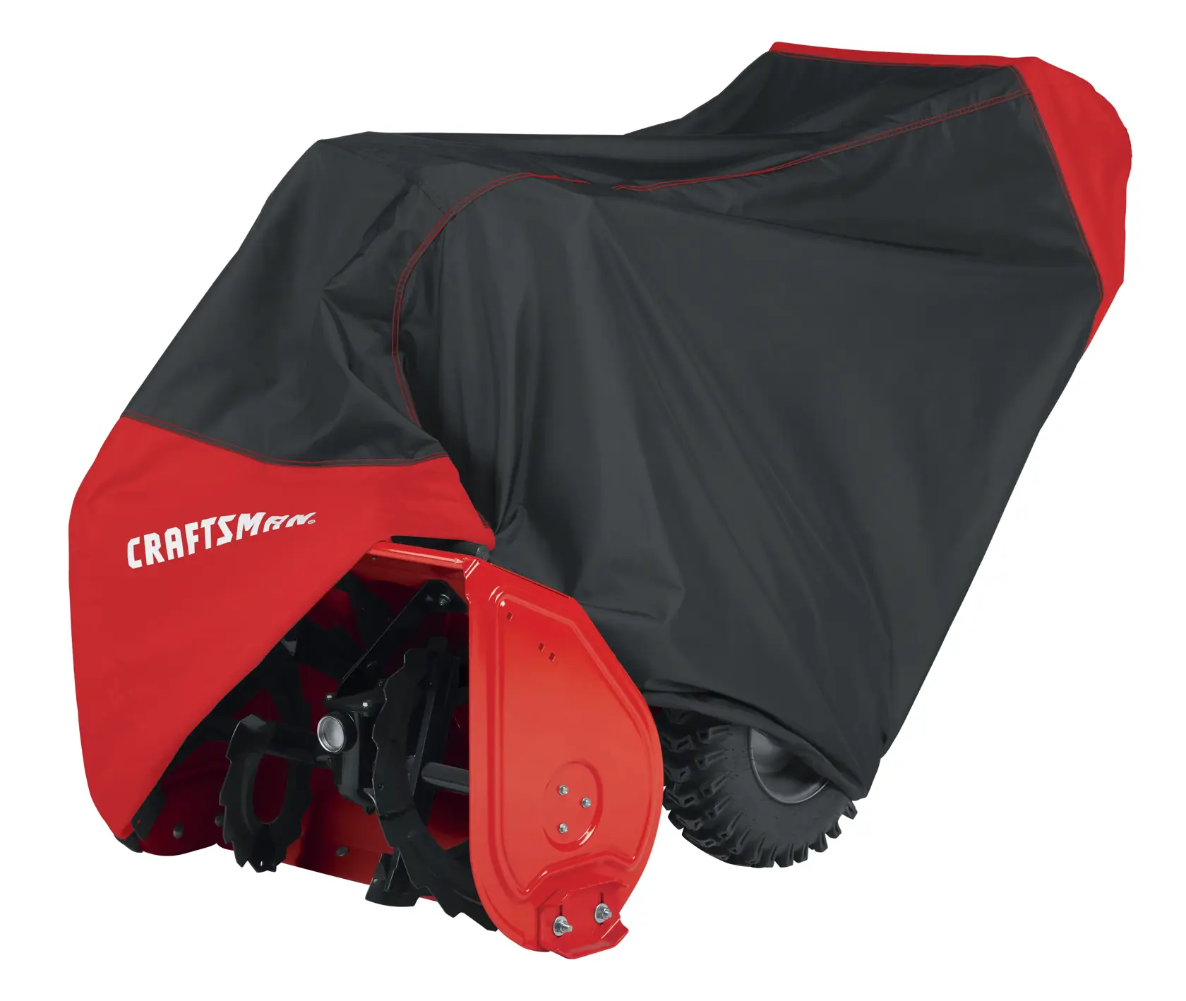 A red and black protective cover shields a Craftsman snow blower, with part of the auger and tire visible.