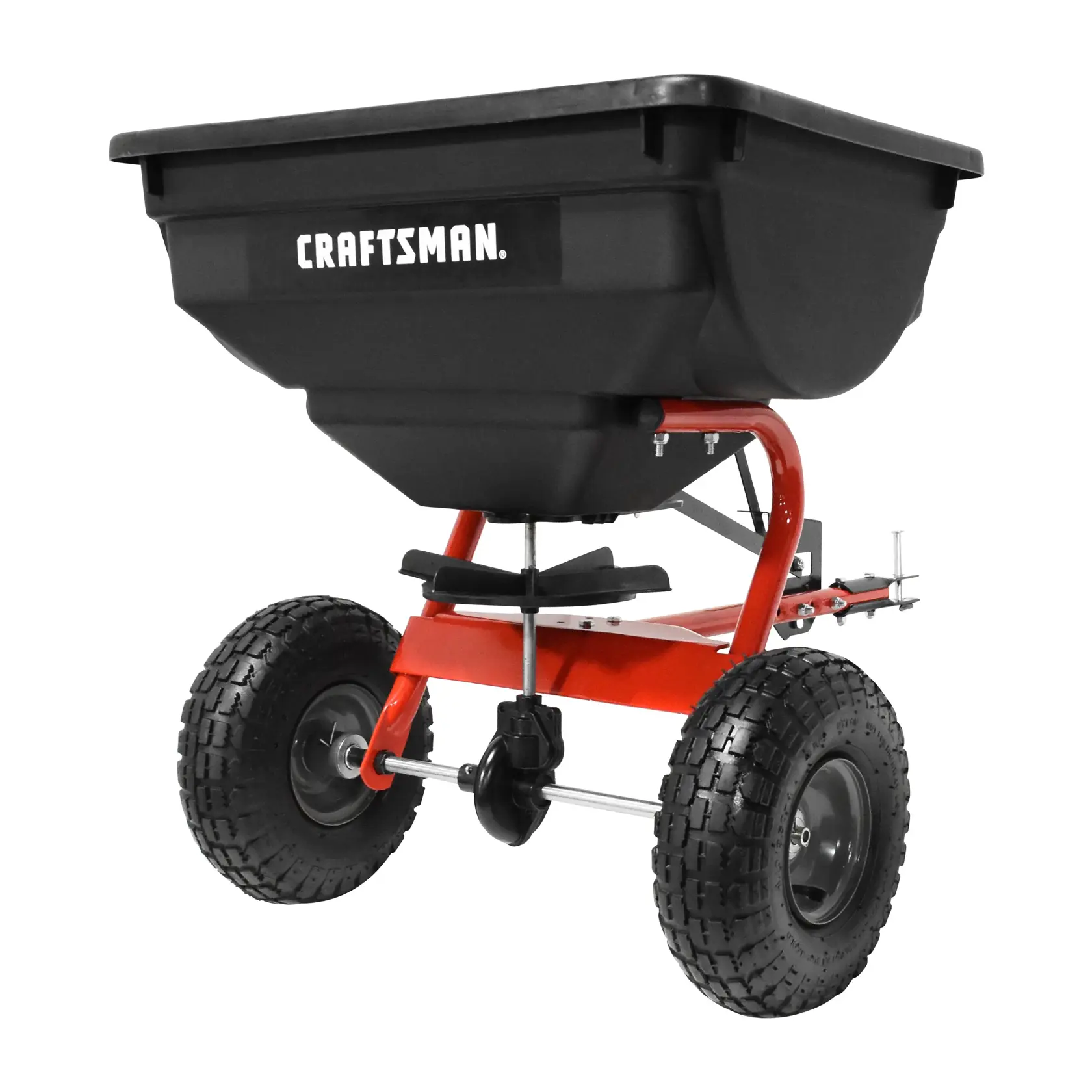 A black and red push lawn spreader with two large tires and a plastic hopper. The brand name 'CRAFTSMAN' is displayed on the hopper.