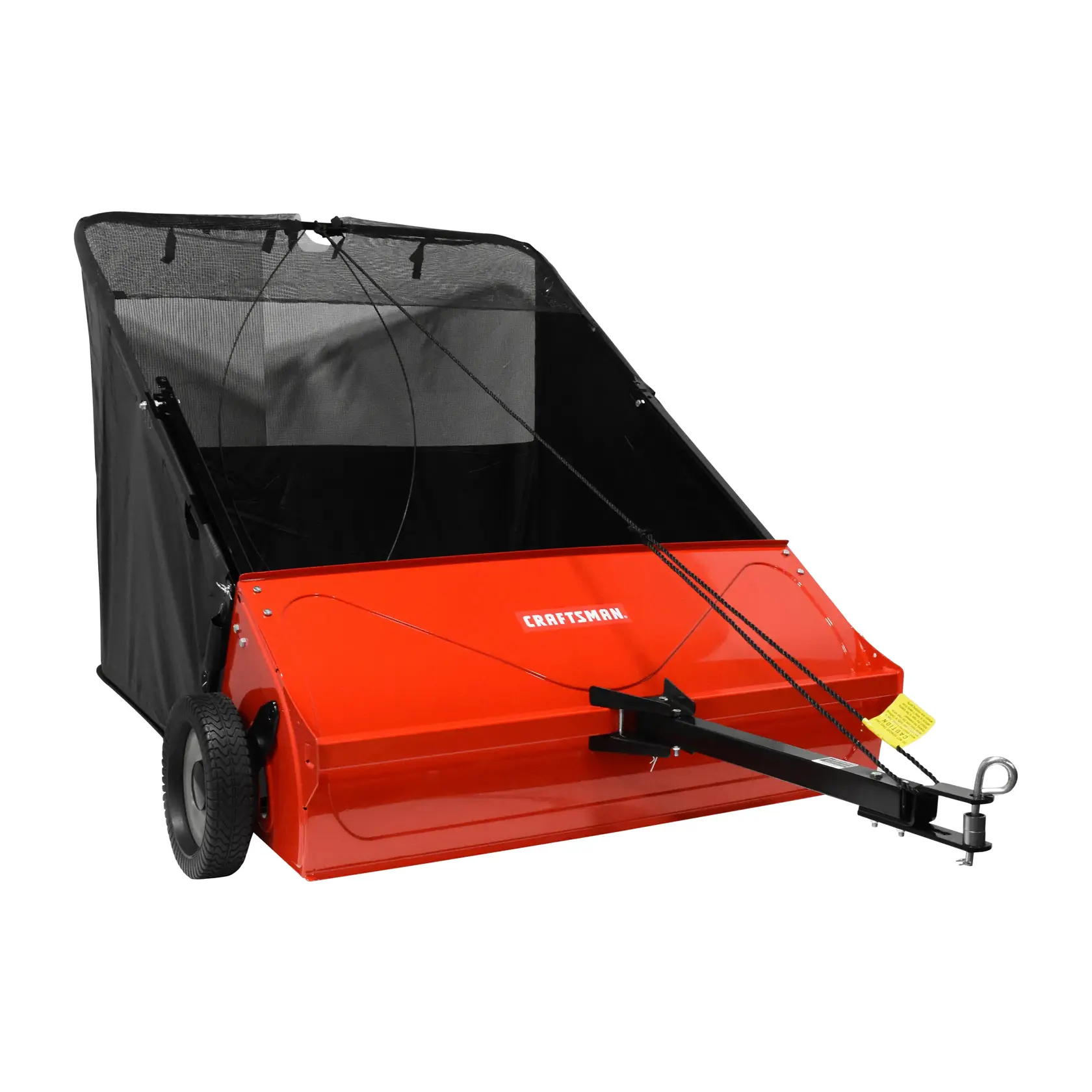 A red and black lawn sweeper with wheels and a tow bar, designed for attaching to a lawn tractor to collect grass clippings and debris. The front panel is labeled with the brand Craftsman.