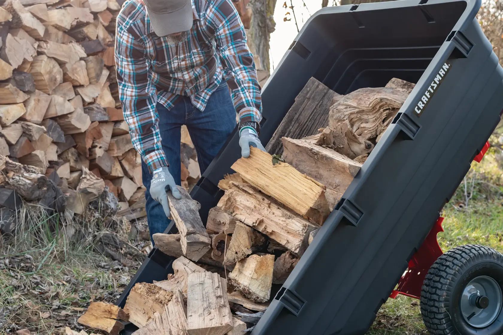 17 cubic foot poly cart being used to carry wood.