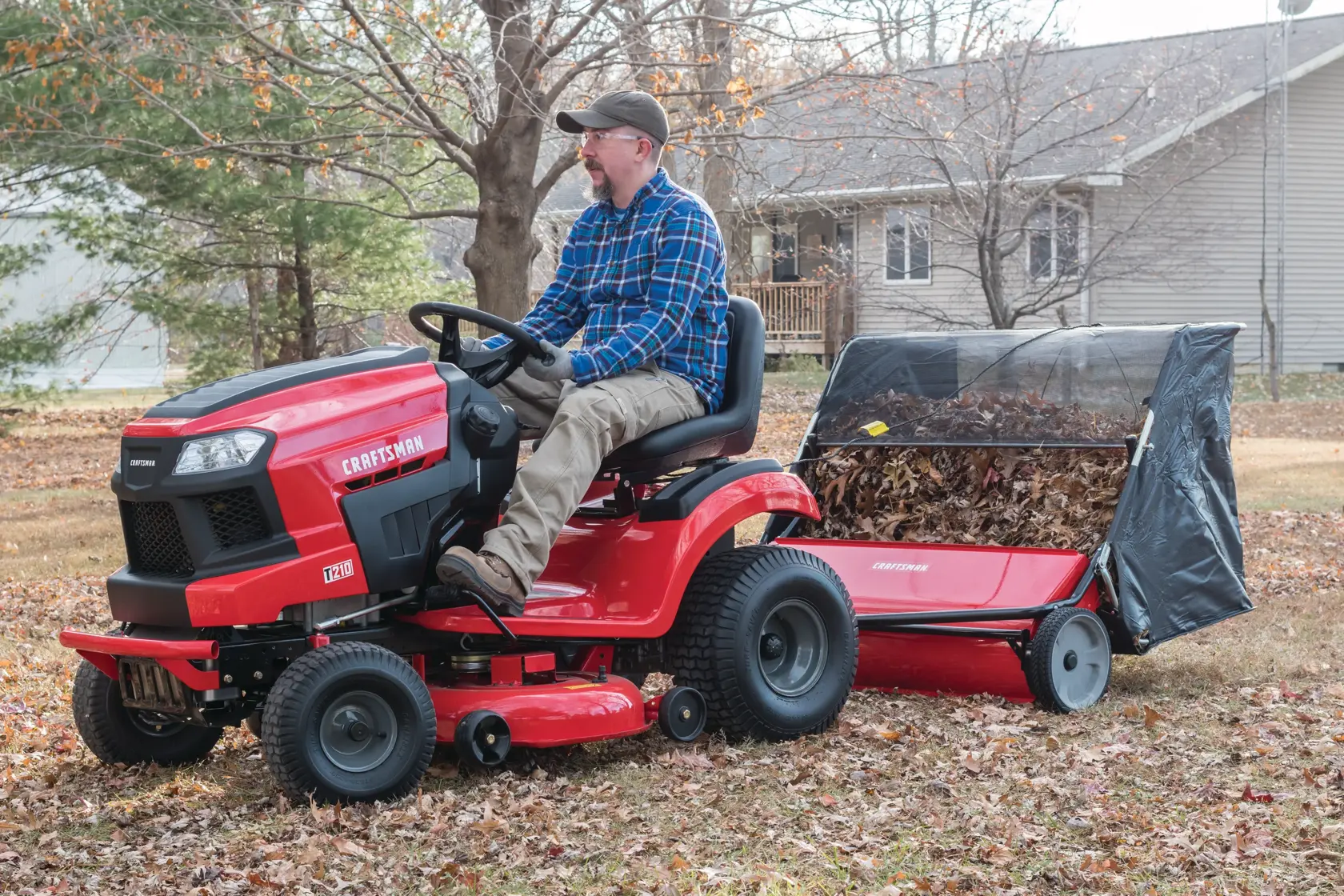 42 inch high speed lawn sweeper being used to clean yard.