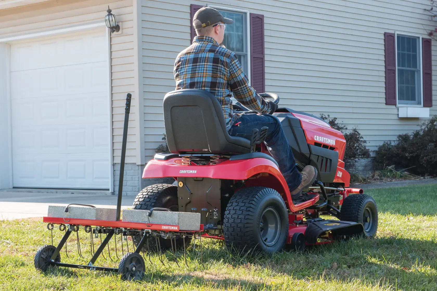 40 inch rear mount dethatcher being used to lift matted layers of lawn surface.