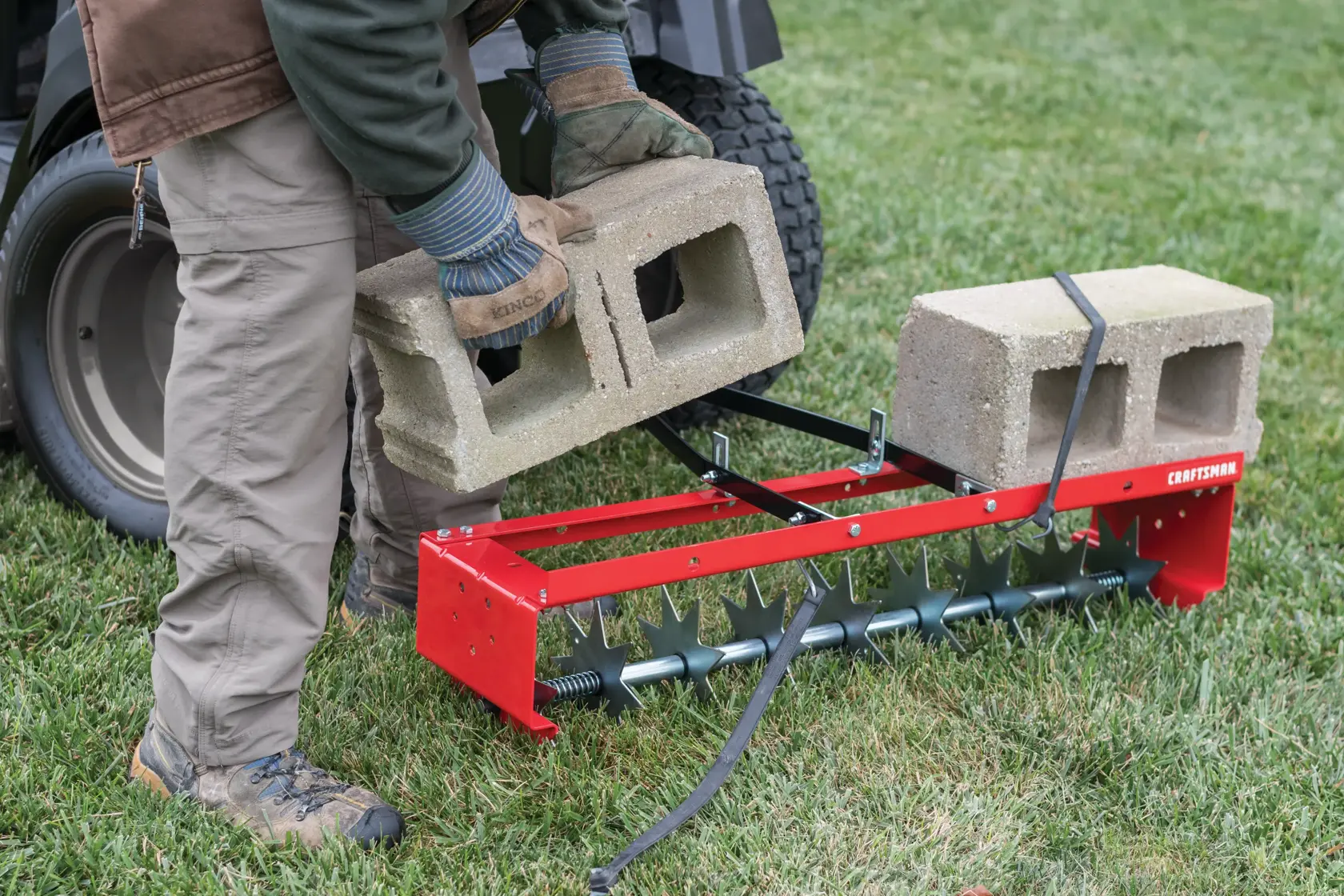 36 inch spike aerator load being placed on it.