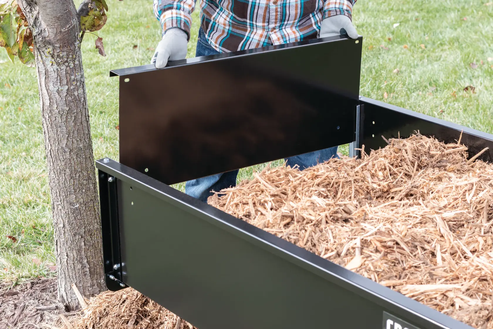 12 cubic foot steel dump cart tailgate being removed.