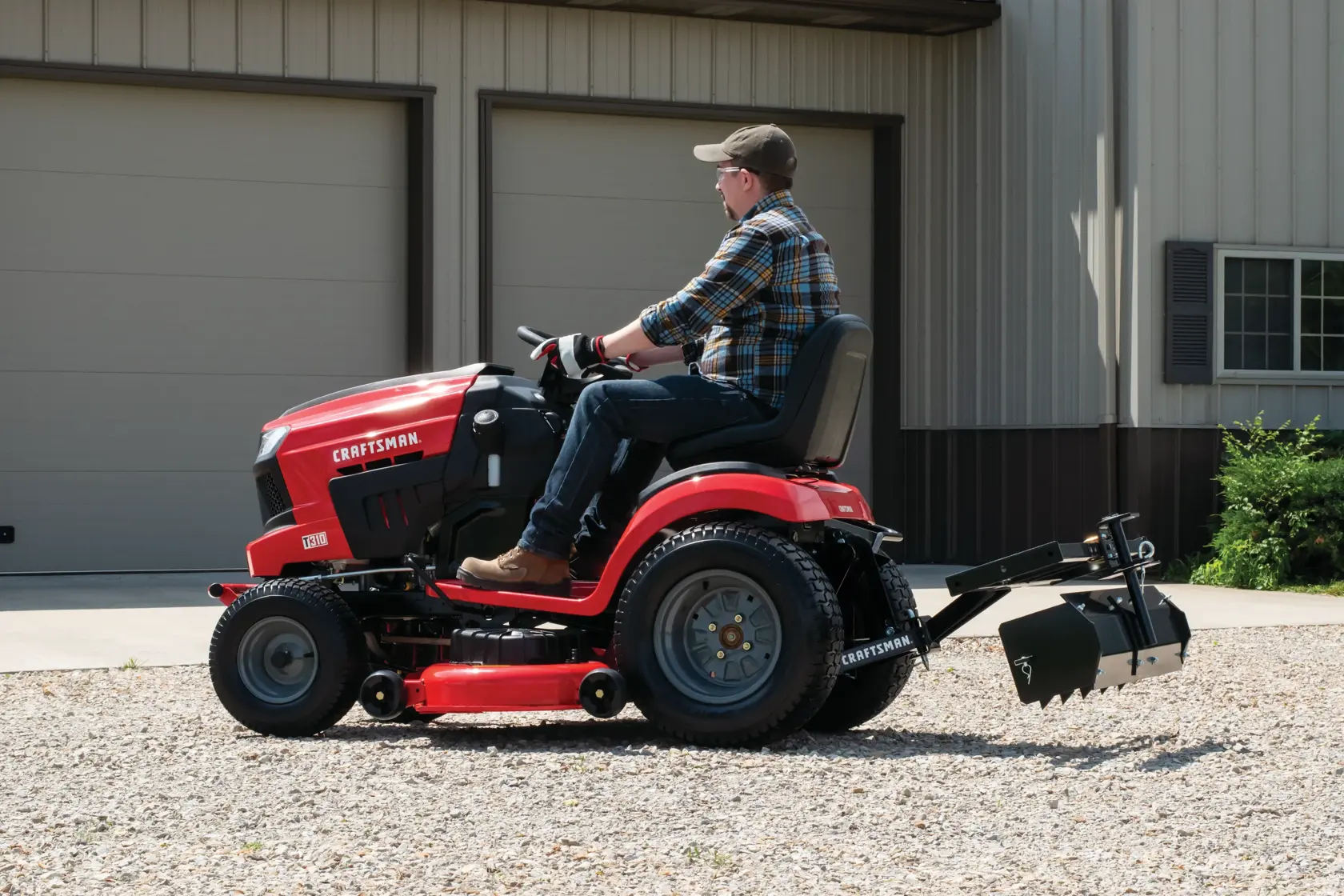 Sleeve hitch being used to connect ground engaging attachments with lawn mower.