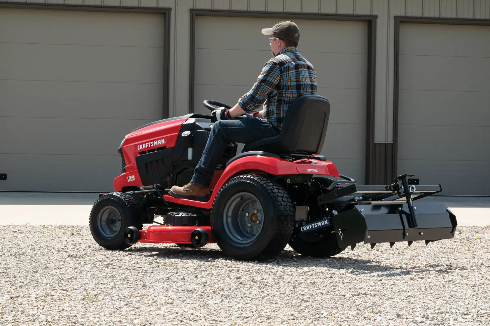 Sleeve hitch being used to connect ground engaging attachments with lawn mower.