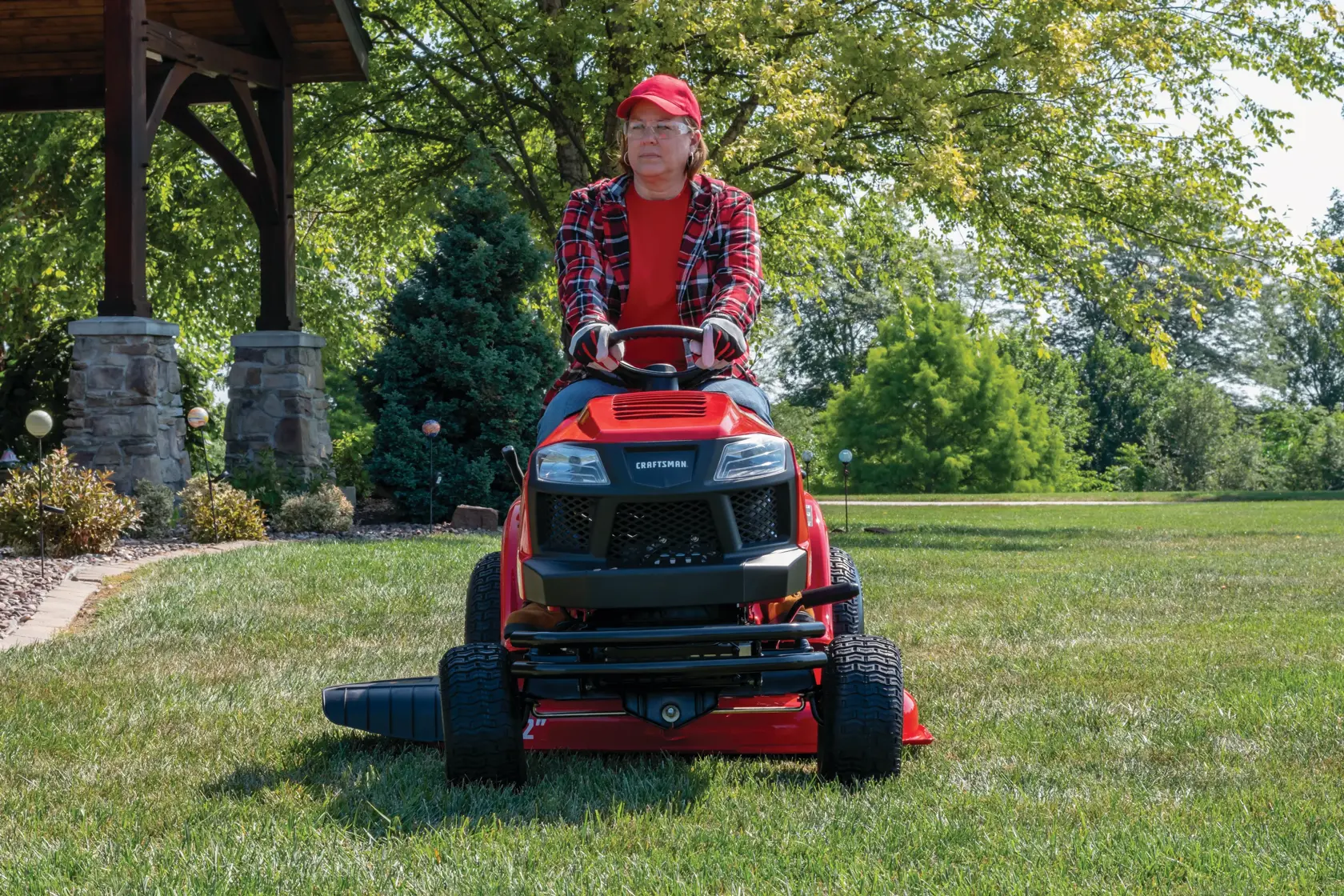 Dual bar bumper being attached to front on lawn mower.