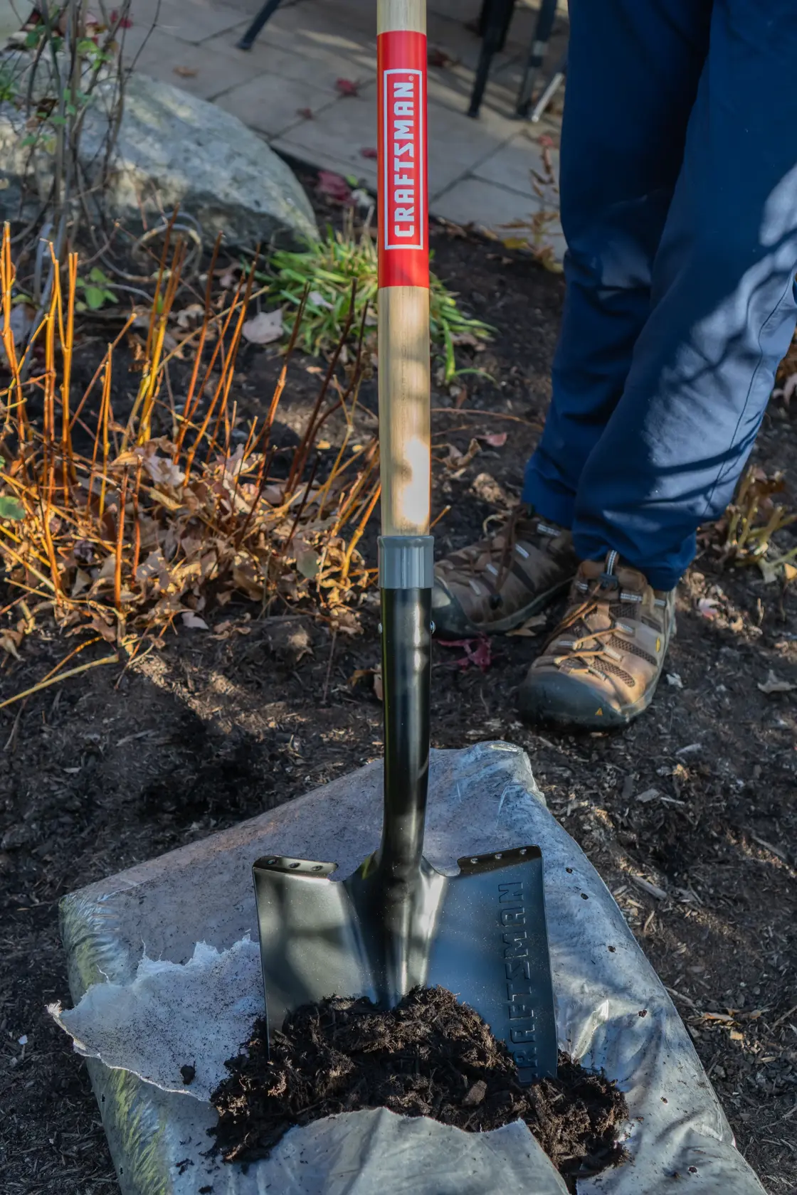 Long Handle Cleated Step Digging Shovel with wood handle and cushion grip, in action 