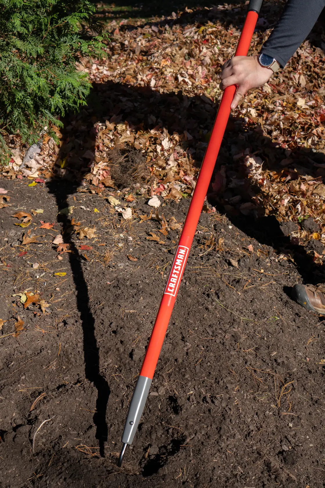 Long Handle Forged Steel Chopping and Weeding Garden Hoe with fiberglass handle and cushion grip, in action 