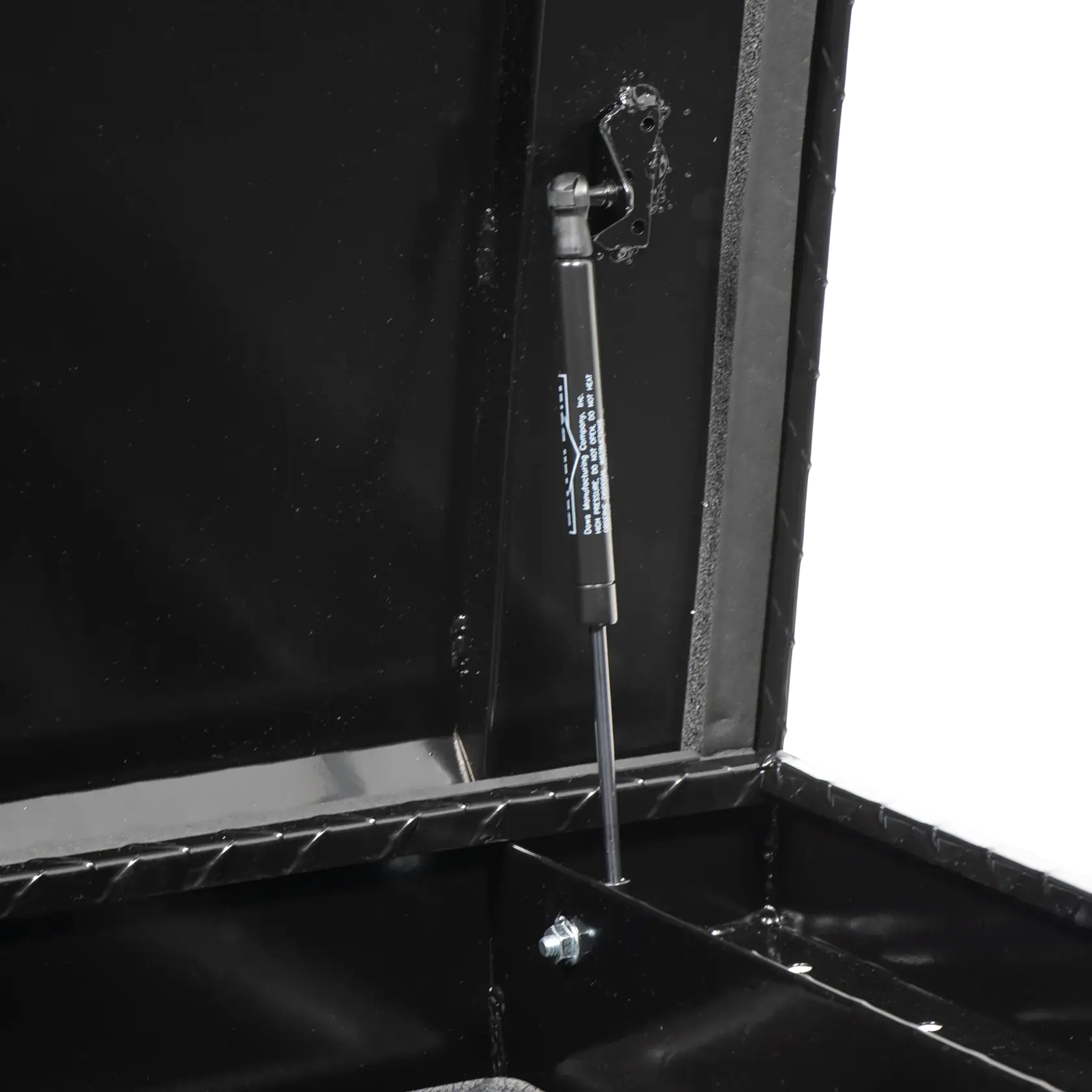 CRAFTSMAN CMXTBAD73217204 black storage box lid gas strut, close-up angled photo.